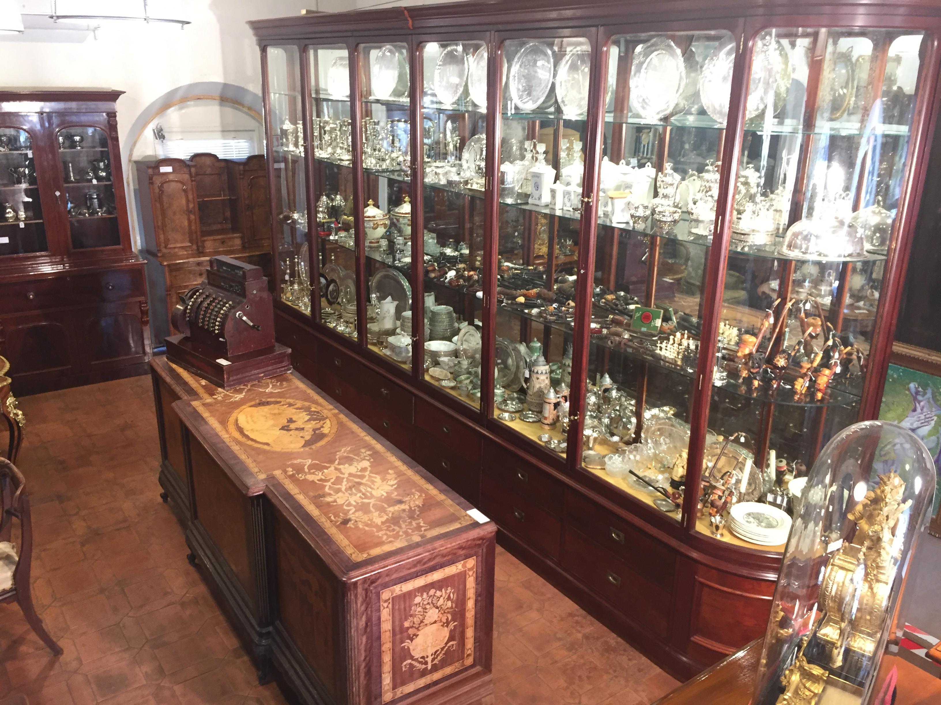Fantastic shop display cabinet, in mahogany, 12 draws, original ironware. Patented bronze handles, doors with anti-dust system, completely dismountable into several pieces. Lighting system put in the 1980s. Original glass, in perfect condition, the