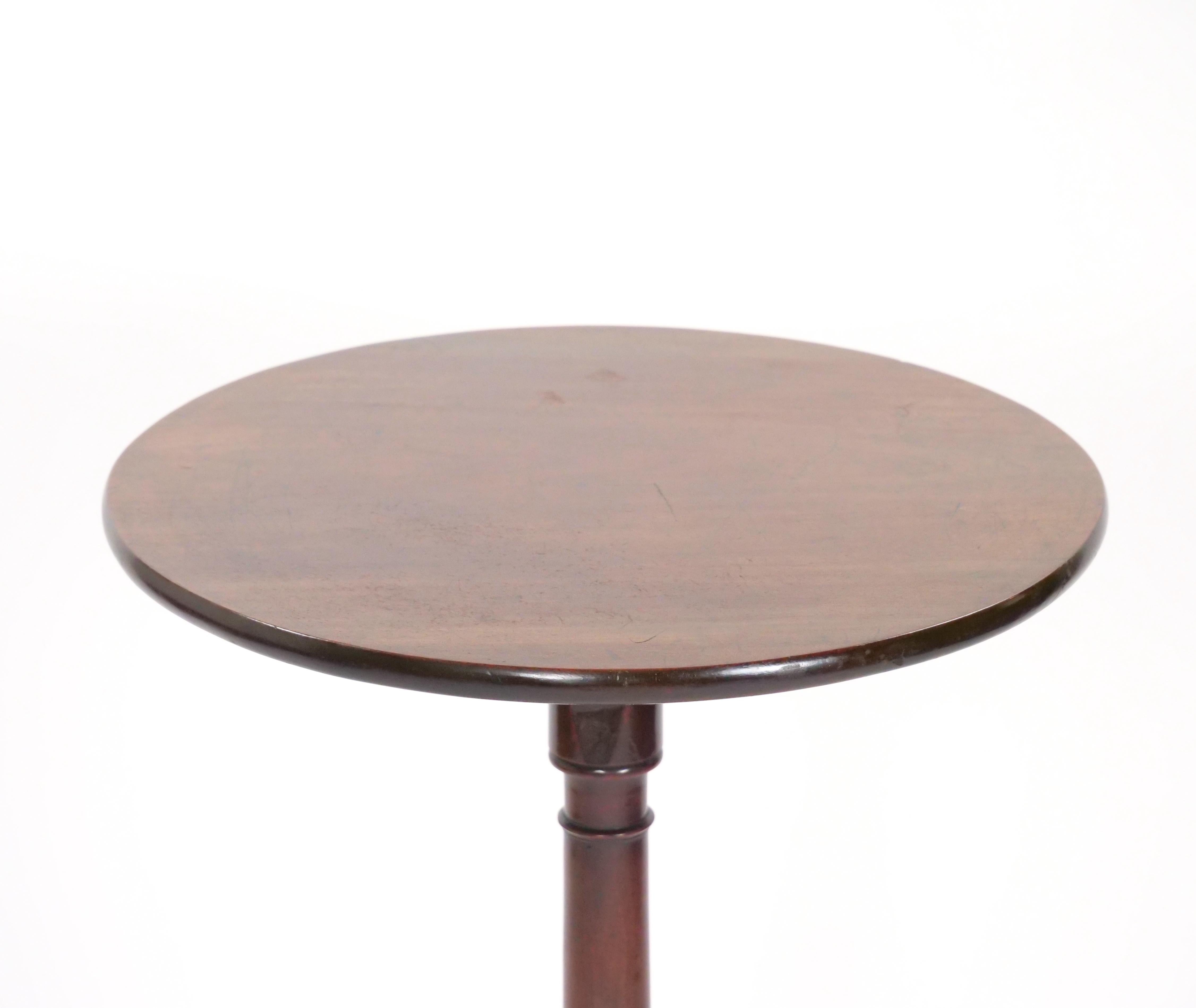 Add a touch of Victorian elegance to your home with this exquisite 19th Century Mahogany Tripod Pedestal Candle Stand. Crafted with meticulous attention to detail and built to last, this piece exudes timeless charm and sophistication.

Constructed