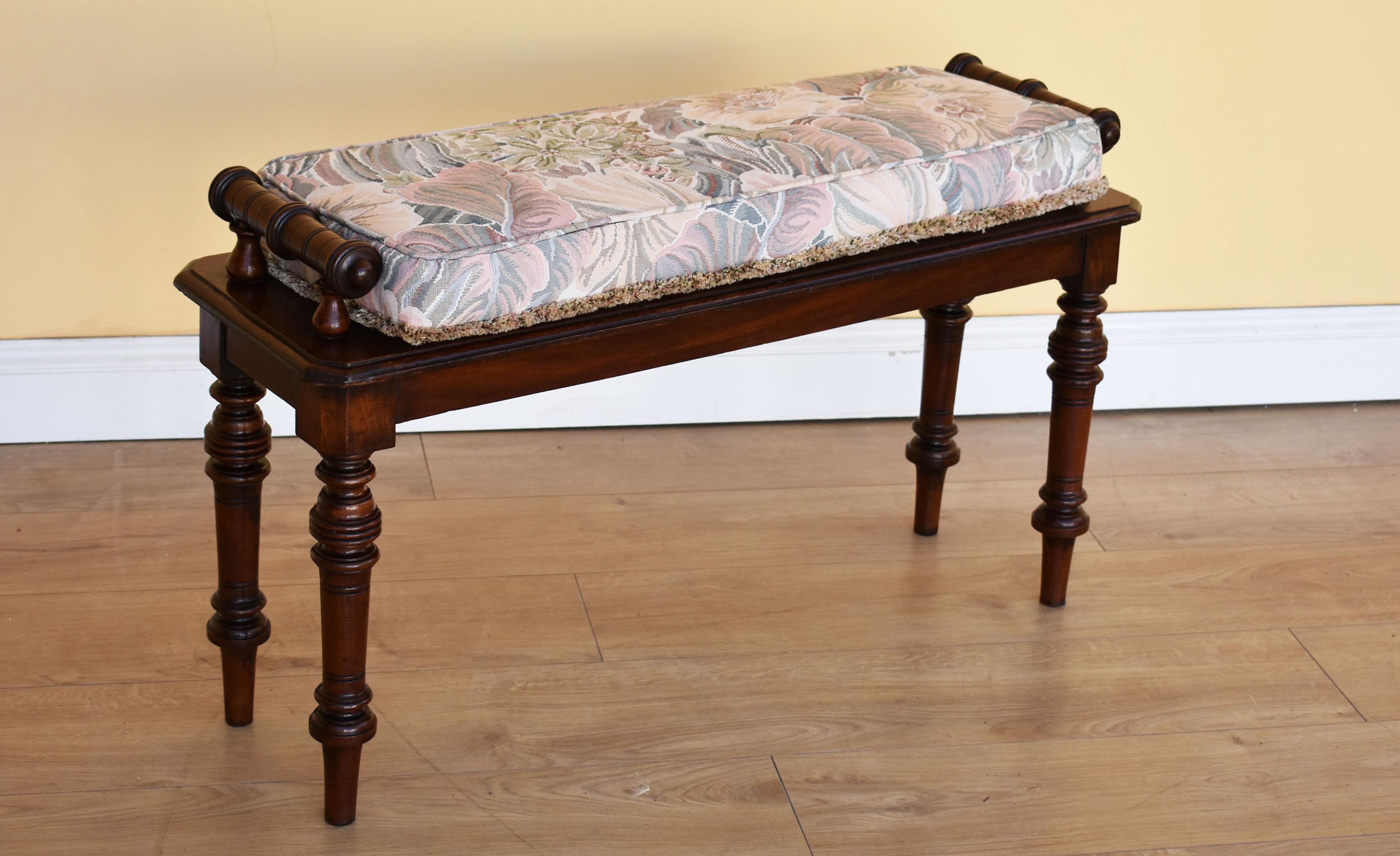 Victorian mahogany window seat in very nice condition having been polished by hand, the seat has nice turned hand rests and stands on elegant turned legs. Includes removable cushion. Ideal seat to place under a window, hall or end of bed.