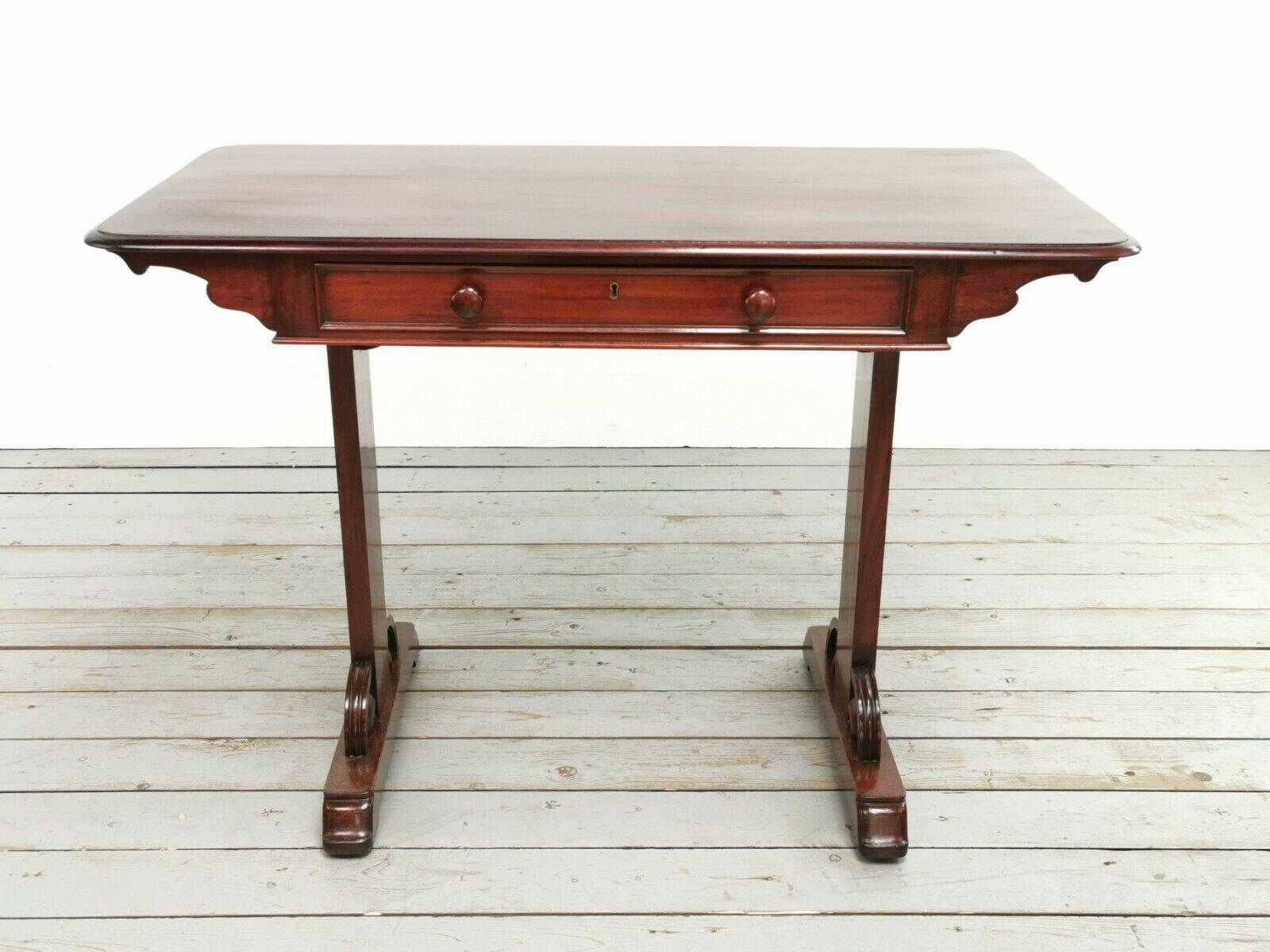 Victorian writing desk

A writing desk, side table or centre table dating to the Victorian era.

Overhanging top edge with a single drawer to the front and faux drawer to the rear giving the same look on each side, each drawer with turned