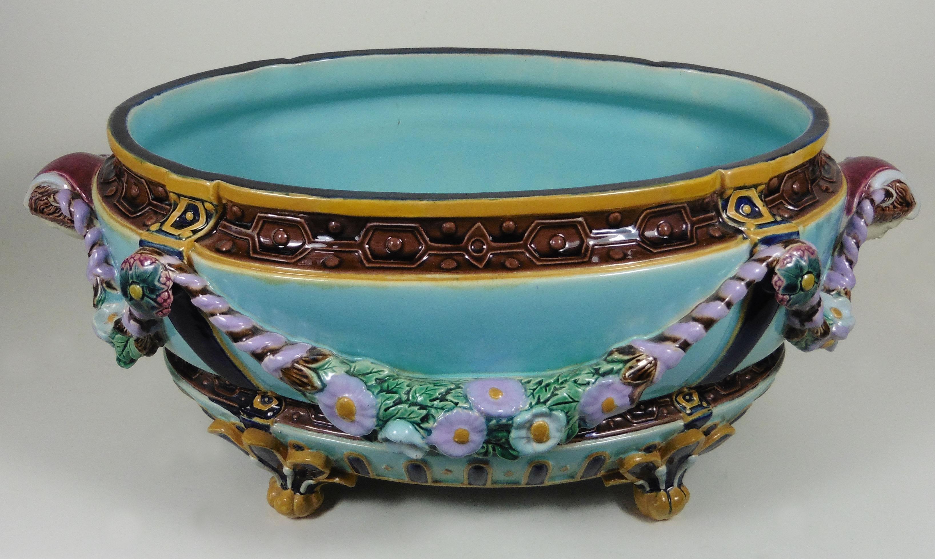 19th century large Victorian Majolica jardiniere with garlands of flowers, the handles are women heads signed Joseph Holdcroft.
A colorful and classical example of the Victorian Majolica.
Good conditions, minor hairline inside on a very thick