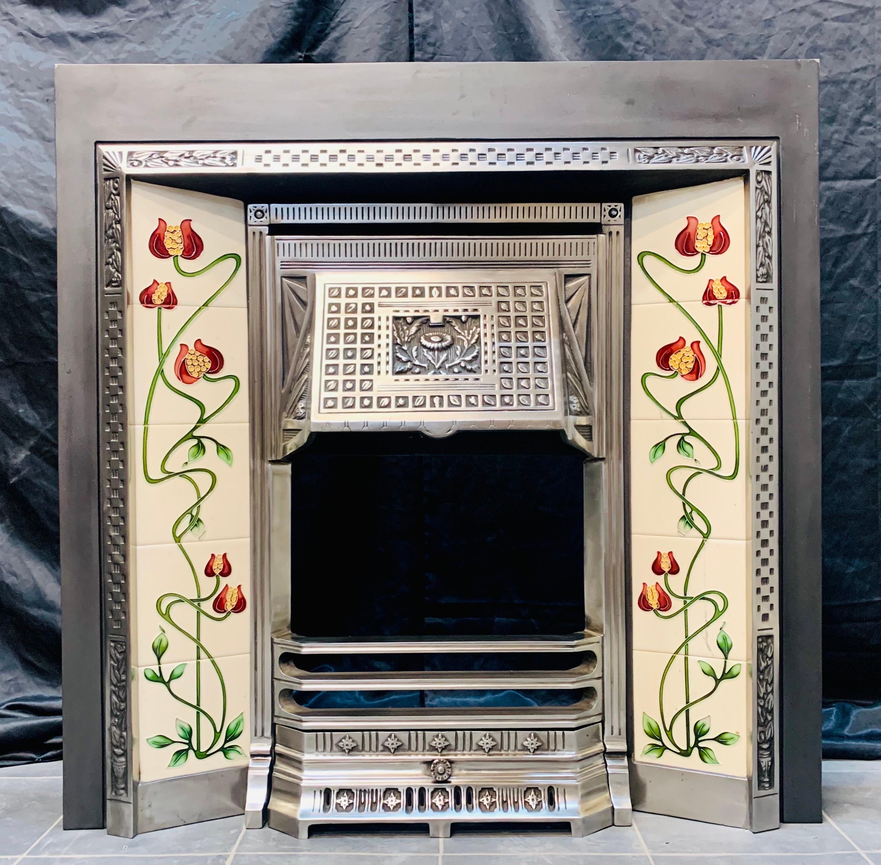 A versatile 19th century Victorian manner cast iron tiled fireplace insert. A graphite outer plate with polished central cast hood and bars with ash pan door, a lovely set of tube lined tiles ( one with a hairline crack) last image. We have many