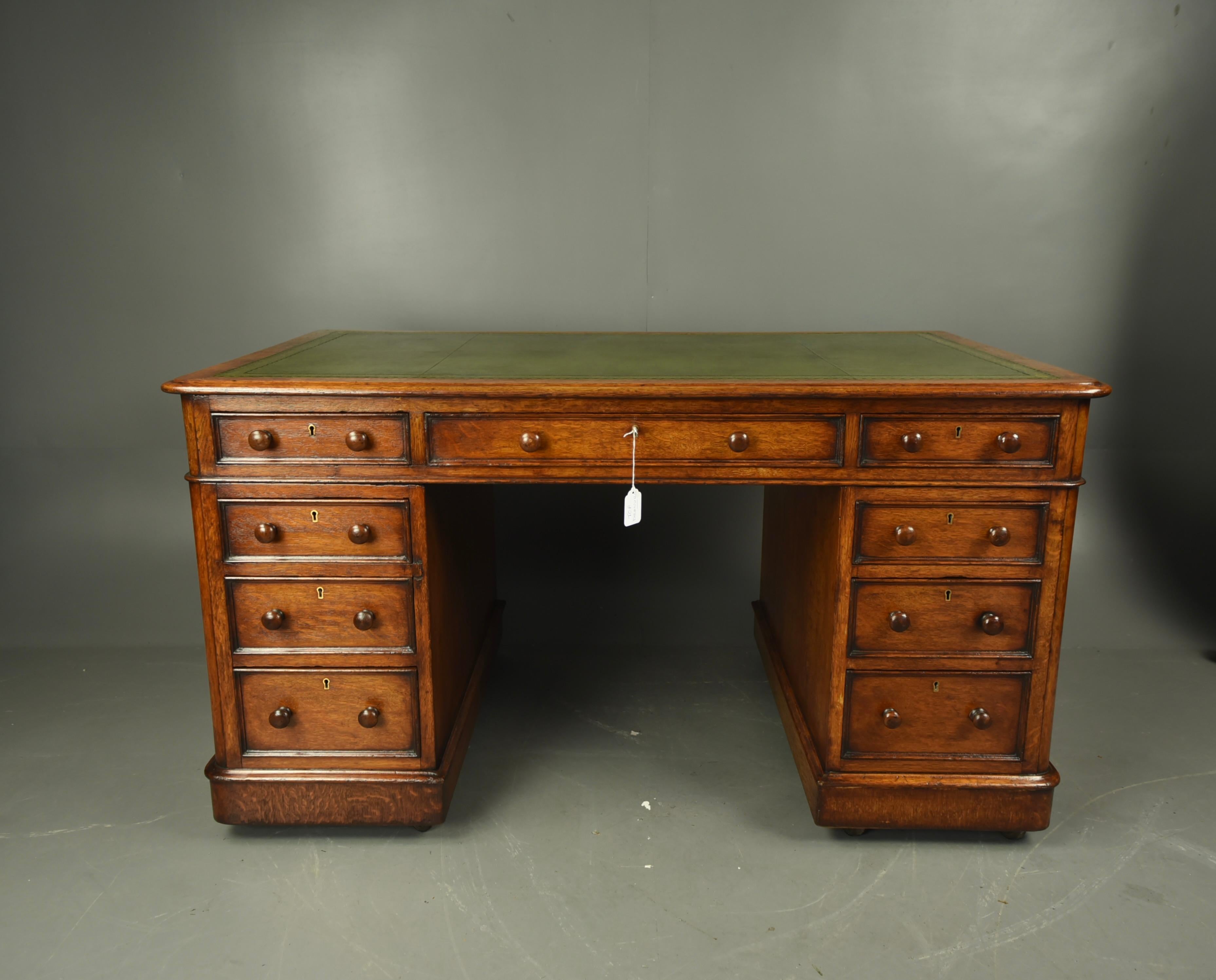 Fine quality Victorian oak pedestal desk circa 1870 .
The desk has 9 mahogany lined hand dovetailed drawers that all slide as they should .There is a single key that locks the top three drawers , The desk has a new quality leather insert with gold