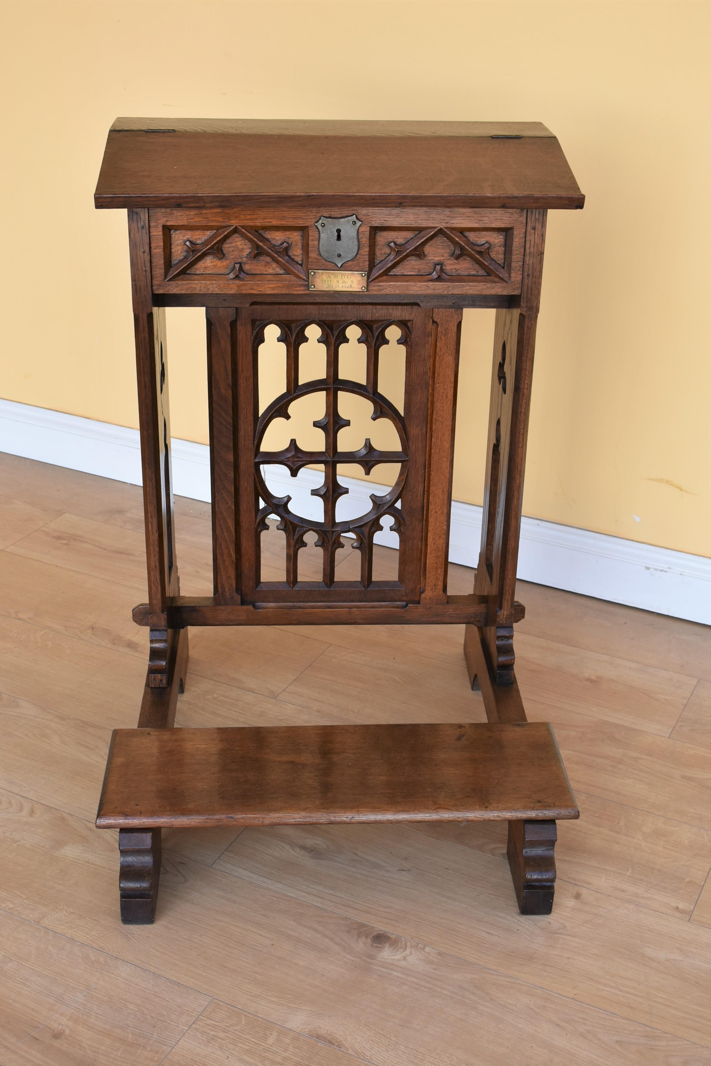 19th century Victorian oak praying lectern-reading stand with pierced ecclesiastical carved upright with hinged slope and kneeling platform. There is a brass date plaque for 1928 which I believe to have been added later.