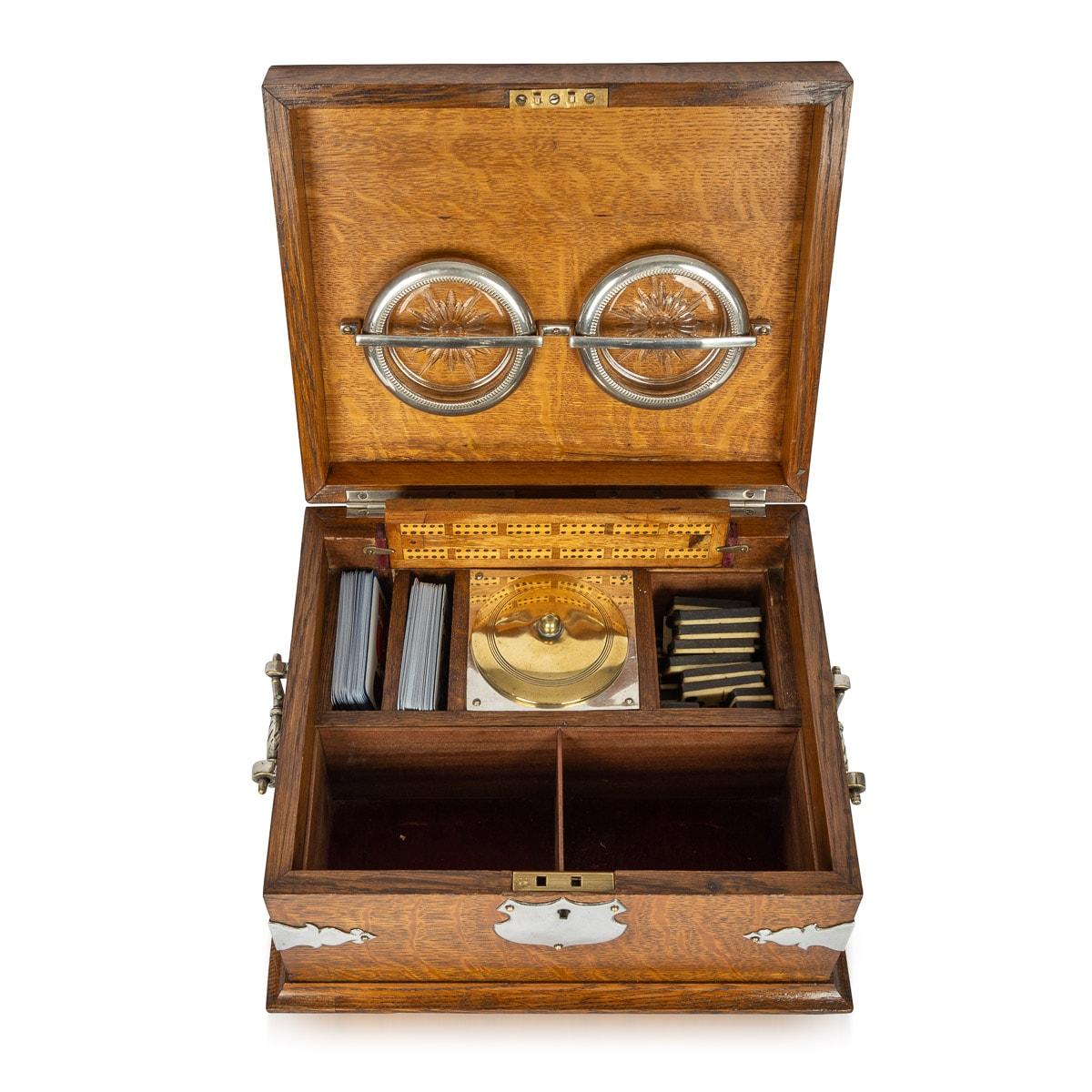 Antique 19th Century Victorian smoker's compendium box with additional games inside. The box has a stunning outside design featuring metal corner protectors, hinged carry handles and a blank plaque on the lid.

CONDITION
In Great Condition, some age