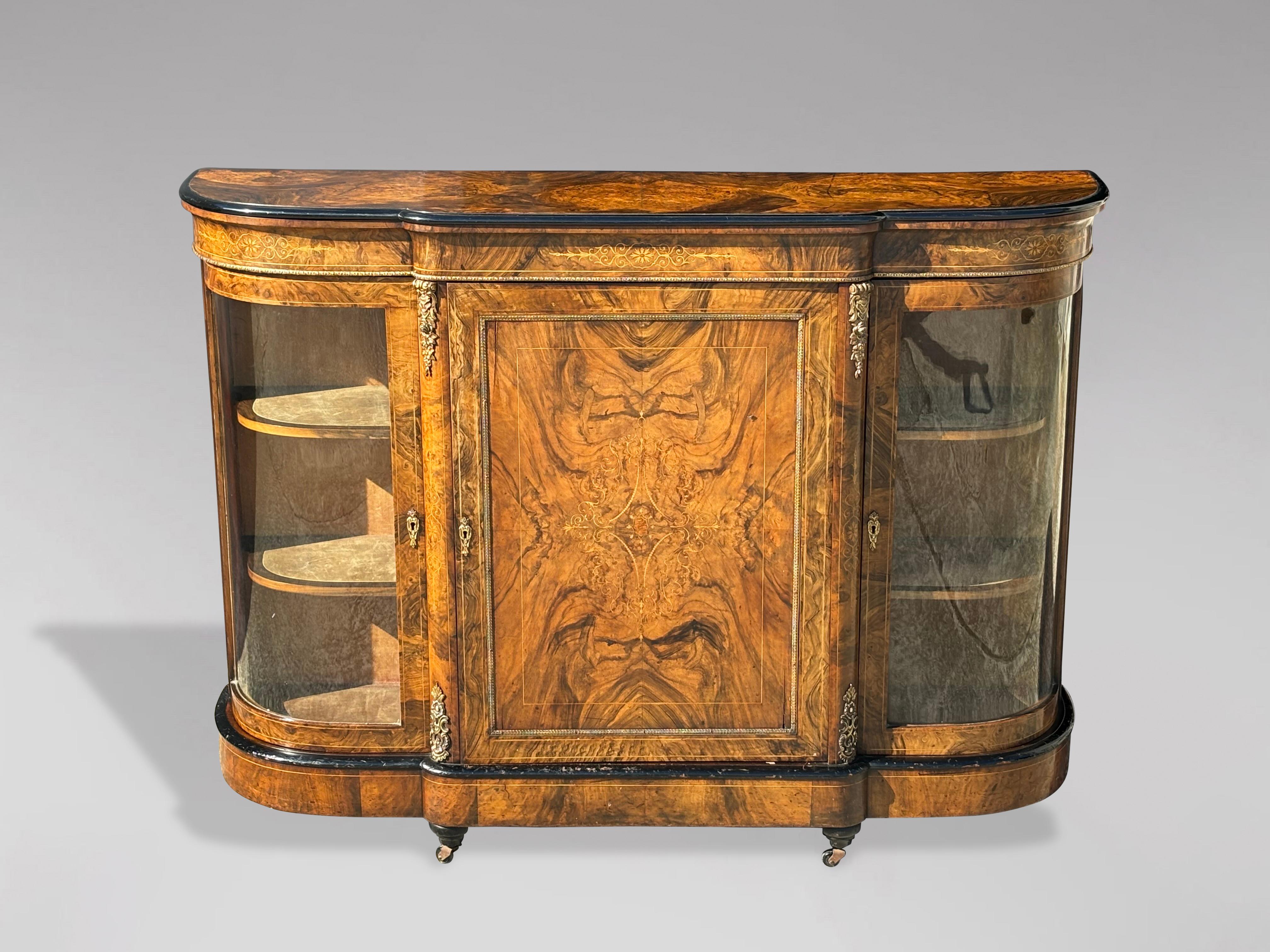 A very fine mid-19th century Victorian period quality figured burr walnut marquetry inlaid credenza with a beautiful colour and patina. The credenza features a quality burr walnut shaped top with matched burr walnut veneers and an ebonized molded