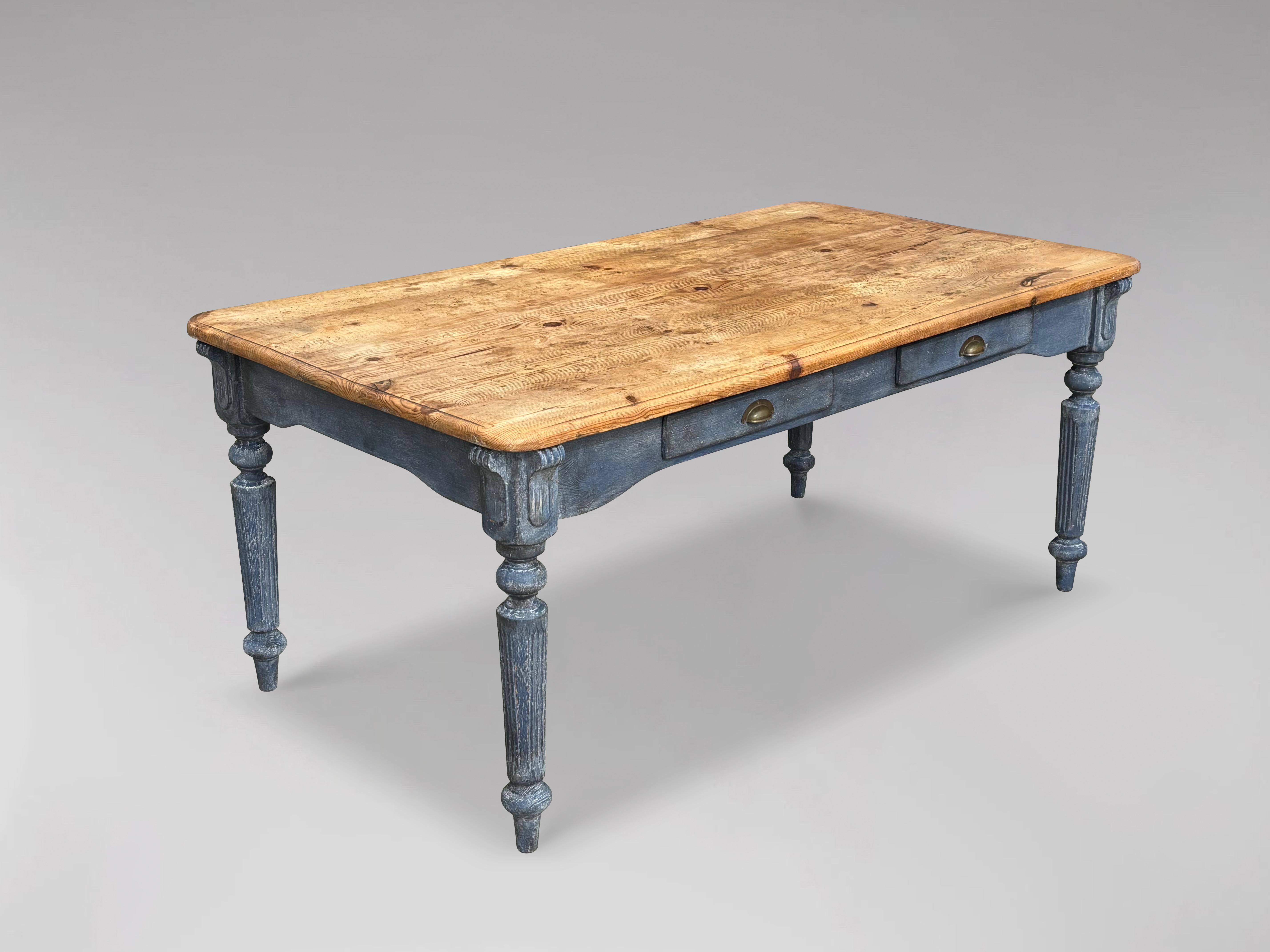 A charming, quality, 19th-century Victorian period pine-top farmhouse kitchen or dining table. It features a rectangular, moulded, planked pine top with rounded corners, above a painted base with a frieze and two drawers on each side. The table