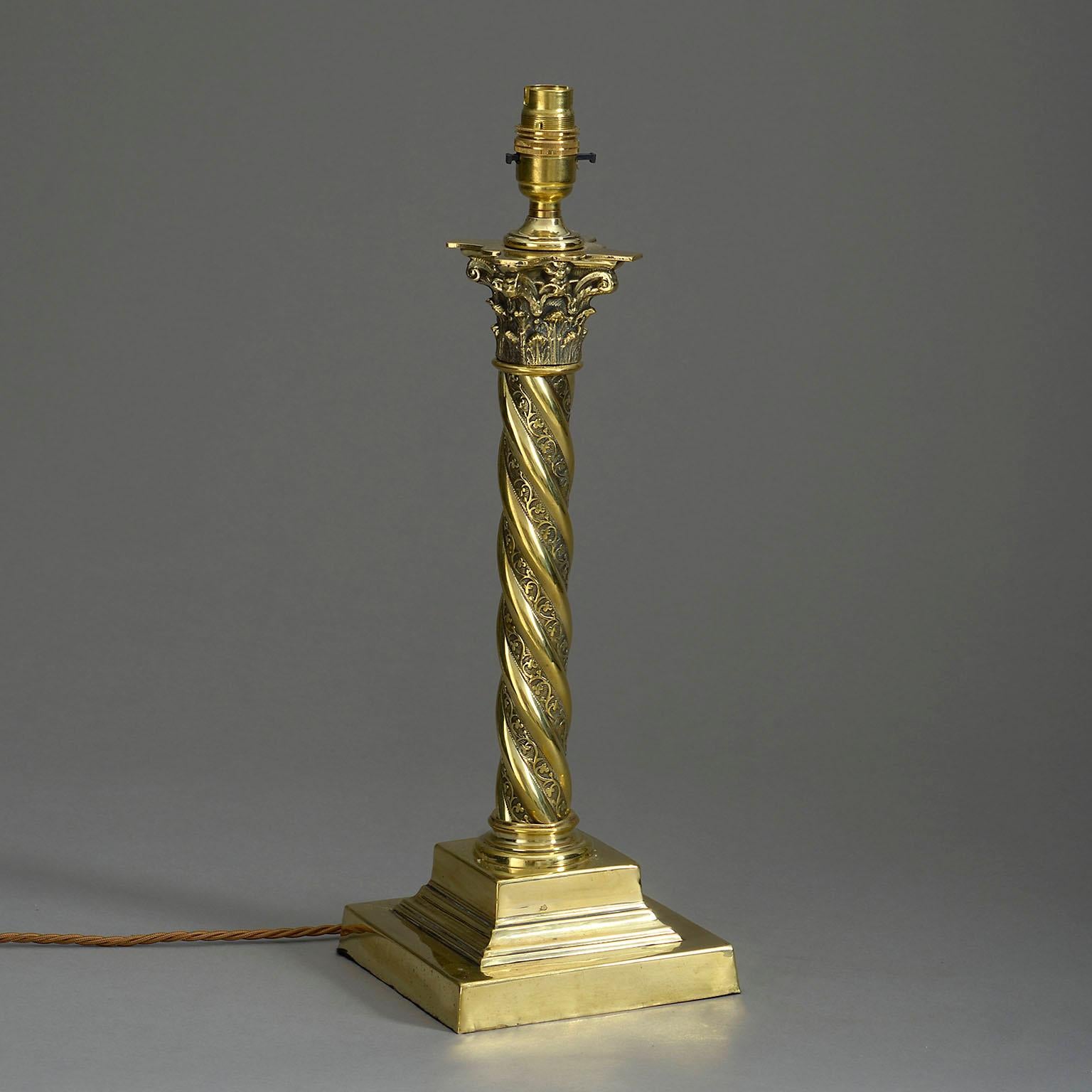 A late nineteenth century Victorian Period brass table lamp, the corinthian capital set upon a spiral stem and terminating in a square plinth base.

Wired to UK Standards. This lamp can be rewired to all international specifications inclusive of