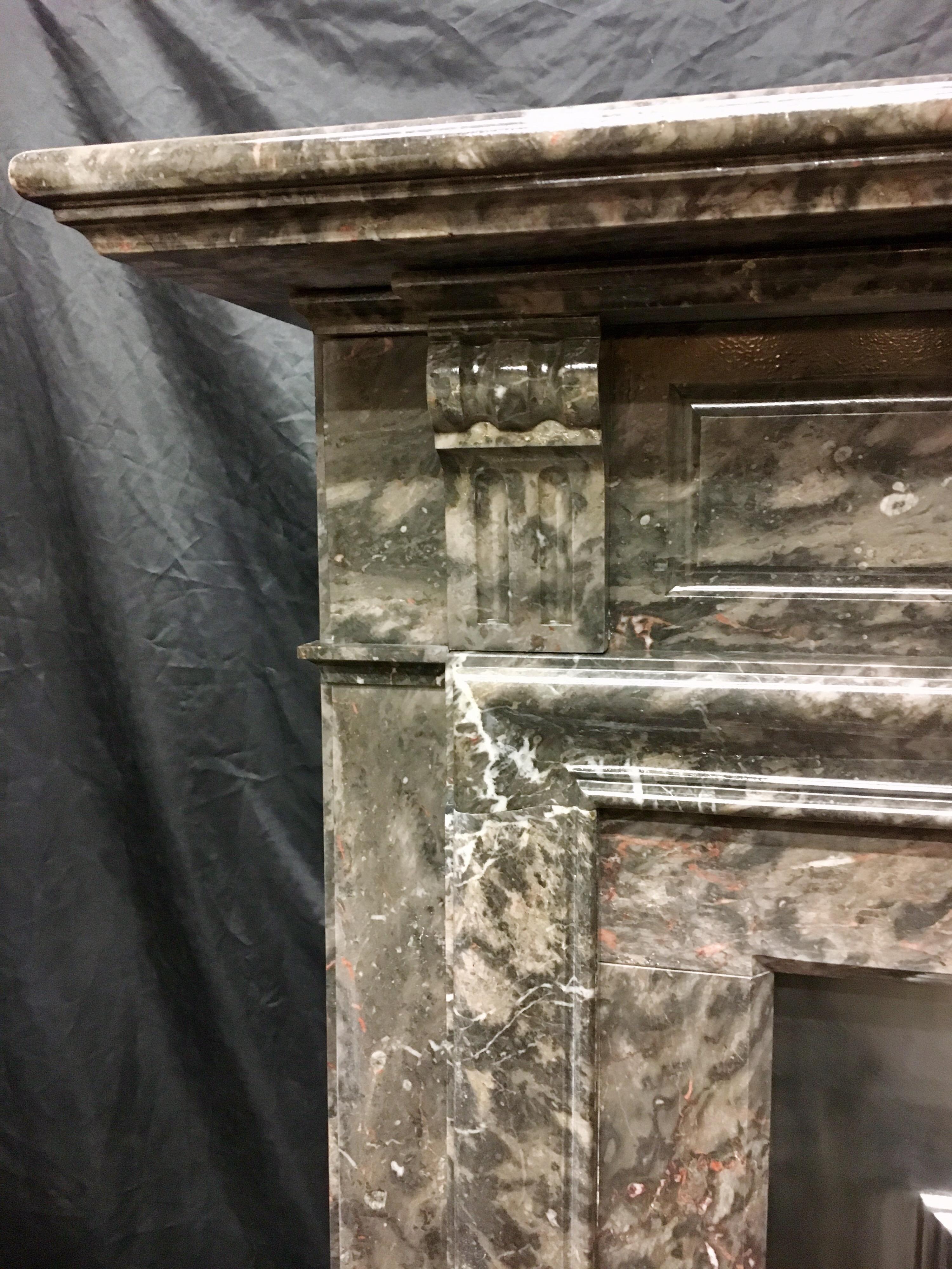 A superb, tall and elegant 19th century rare Victorian corbeled and panelled period fireplace in rich variated- fossilised soft Grey Ashburton marble. This rare and wonderful fireplace, striking with its Fifty Shades of Grey colouration, in its