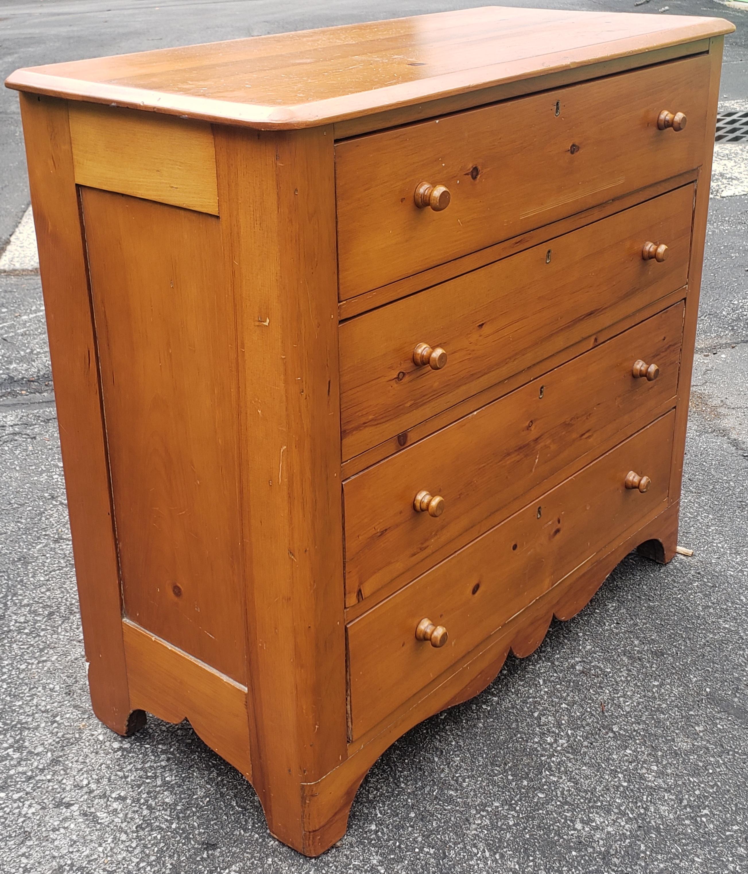 A 19th Century Victorian Solid Pine 4 - drawers chest of drawers. Recently refinished.
Measures 38.75