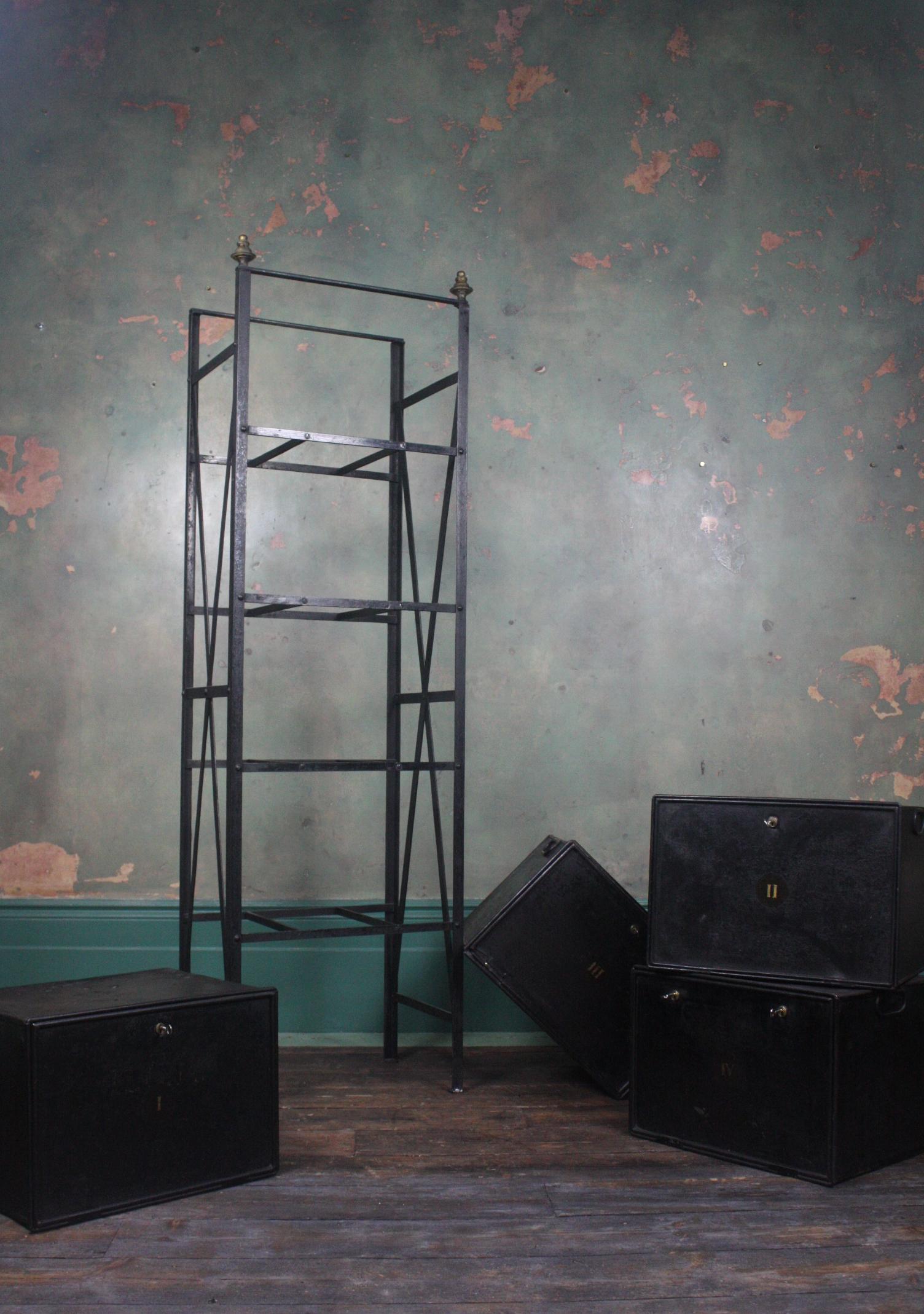 A mid-19th century deed rack with original boxes 

The rack is made from wrought iron and riveted with black enameled boxes that open 

This would of been housed in a solicitors, each box in numbered with earlier traces of original names and