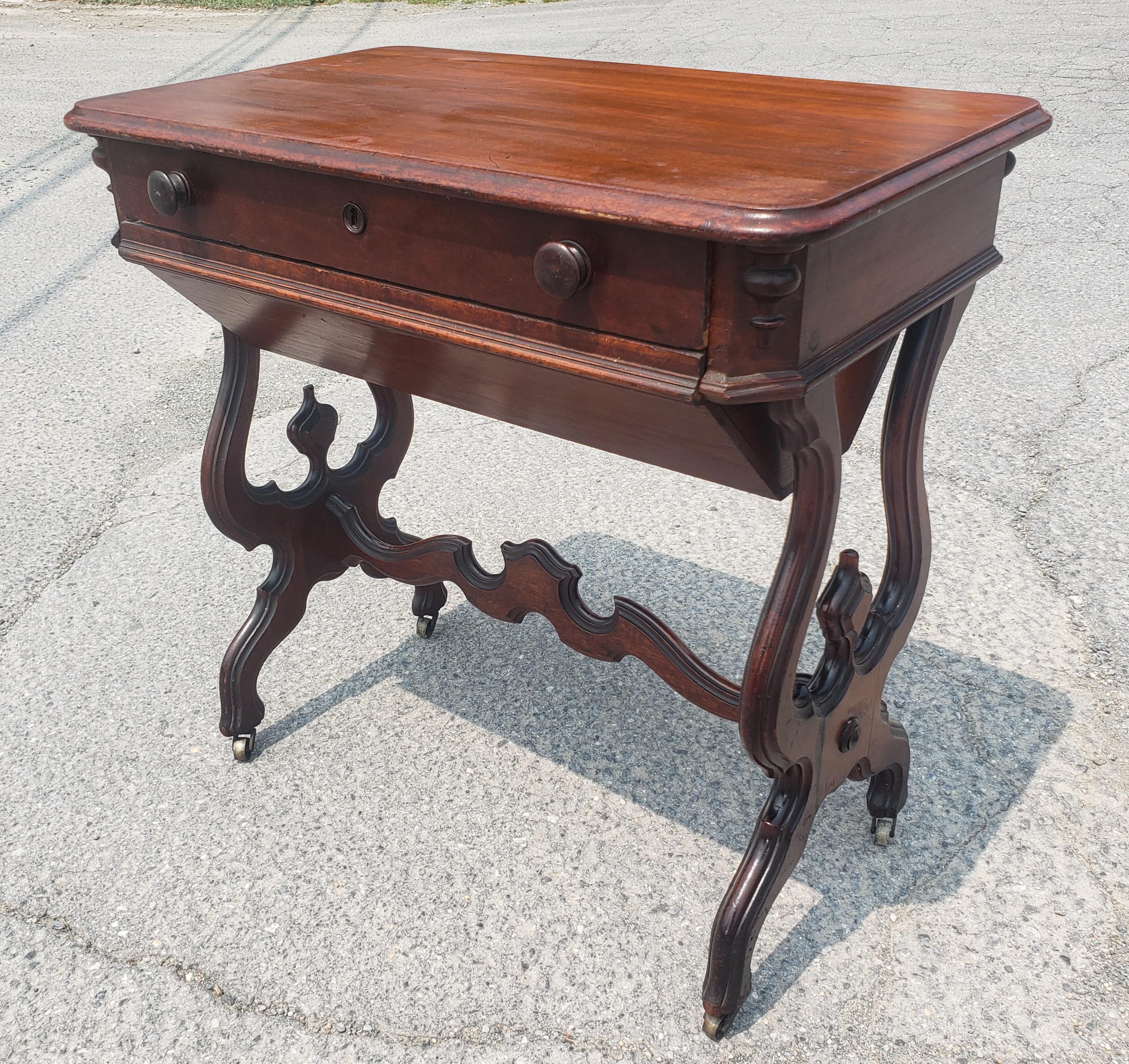 19th Century Victorian Rococo Style Carved Mahogany Rolling Sewing Table For Sale 1