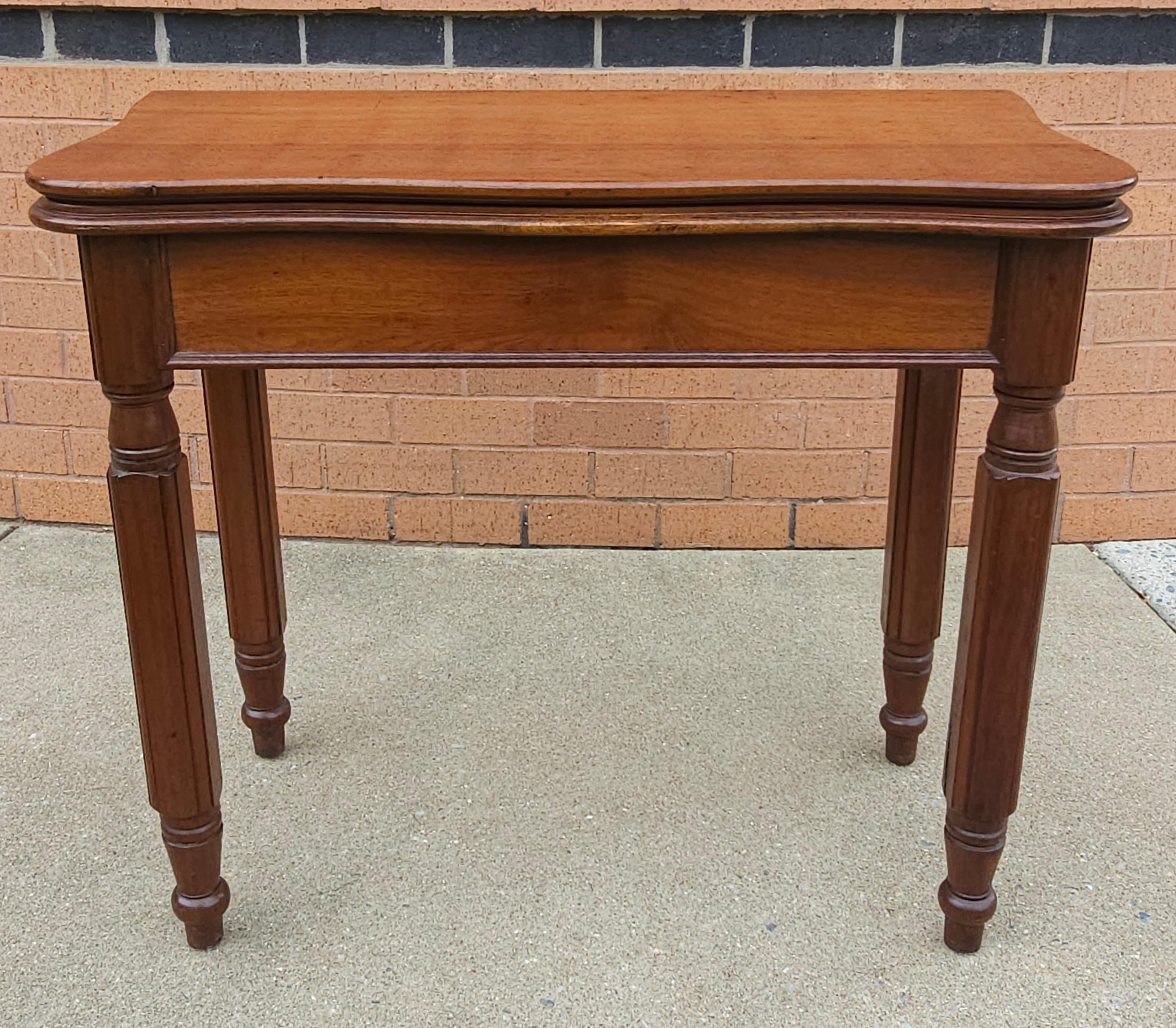 A 19th Century Victorian Rococo Style Walnut Serpentine Fold-Top Tea Table. Measures 34