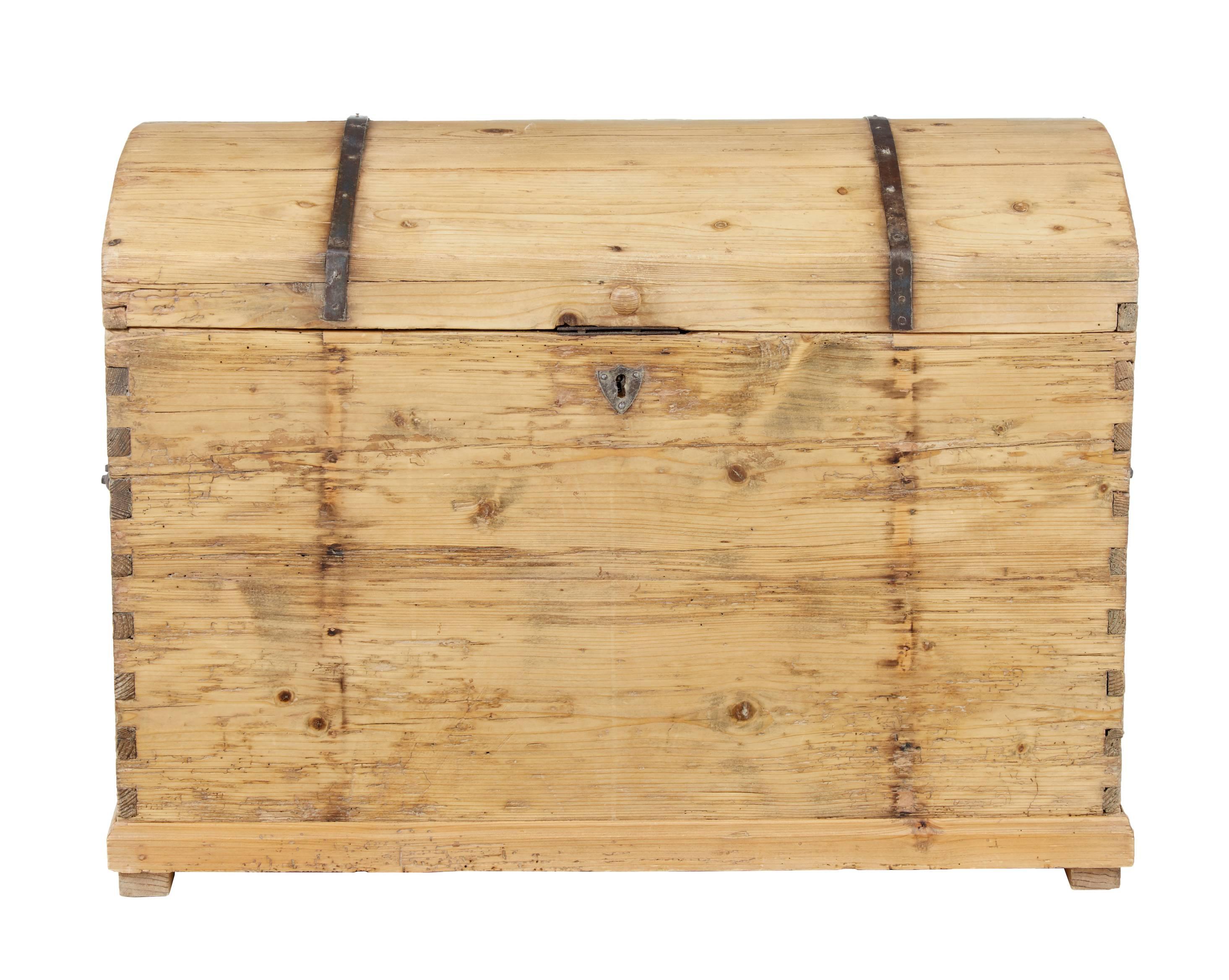 19th century Victorian pine trunk, circa 1860.

Dome top with thin iron strap work on the top and back. Original carry handles to the sides.

Metal work has long been removed from the front. Later wooden knob to the front. Minor losses and