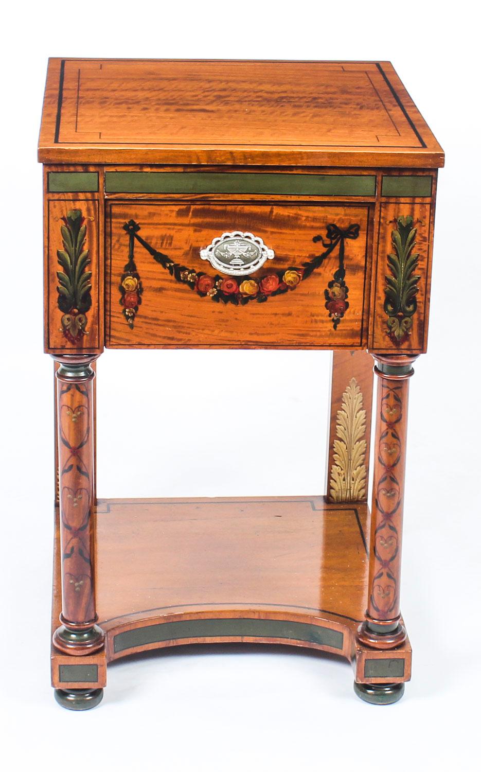 A beautiful antique Victorian freestanding satinwood pedestal cabinet, circa 1860 in date.
 
This superb piece features attractive ebonised crossbanding with exquisite hand-painted decoration consisting of draped ribbons of rock roses, anthemions