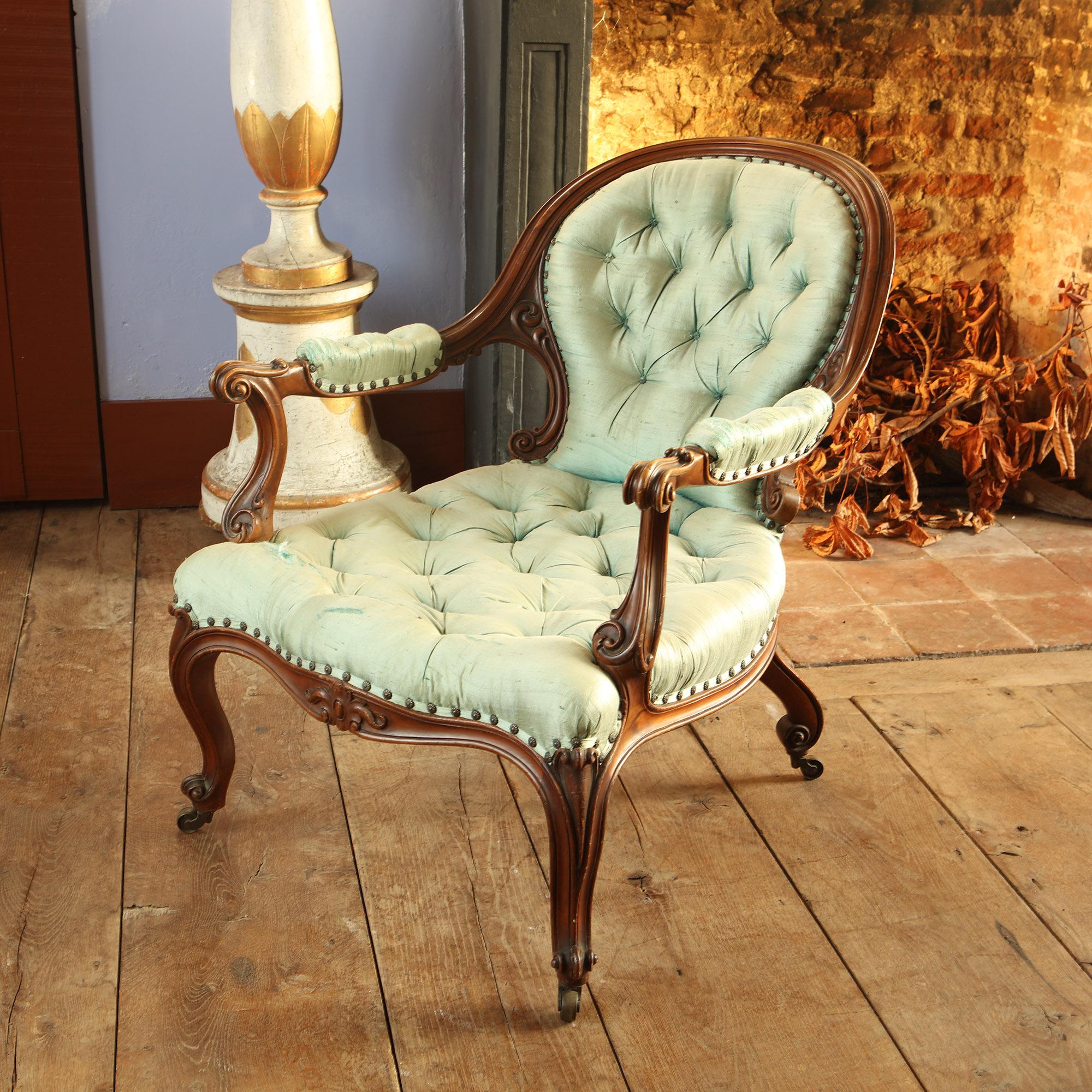 A hghly sculptural Victorian upholstered armchair - undoubtedly by an accomplished maker that we are continuing to research. A very elegant chair in good order, upholstered in blue silk by the current owner.