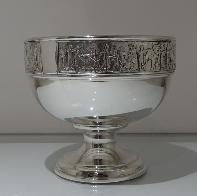 A stunning late Victorian silver plated flower bowl on stand. The bowl has an elegant circular plain formed body which has then had ornate applied plaques mounted below the lower rim for decoration. The circular stand has a decorative outer border
