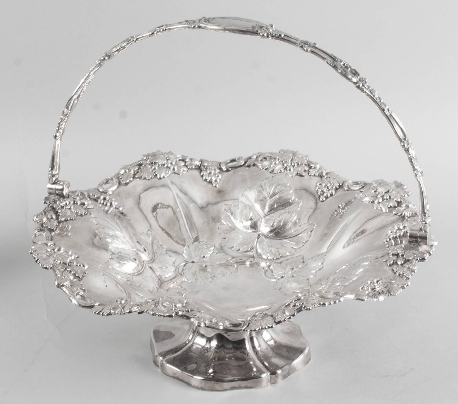 This is a stunning antique English Victorian silver plated fruit or bread basket with fabulous embossed and engraved decoration, circa 1860 in date.

It has beautifully decorated with vines and grapes and bears the makers mark of the London