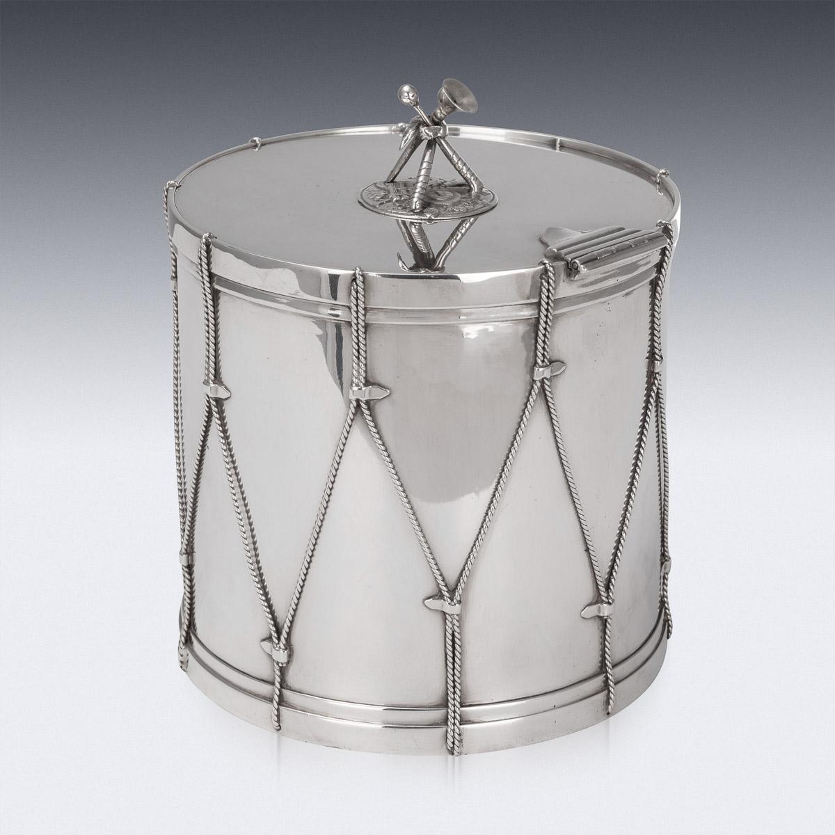 Antique 19th century Victorian silver plated large ice bucket, in a form of a regimental drum, intricately made and applied with twist ropes and held with straps, the hinged lid mounted with a cast finial depicting drumsticks and a cavalry trumpet.