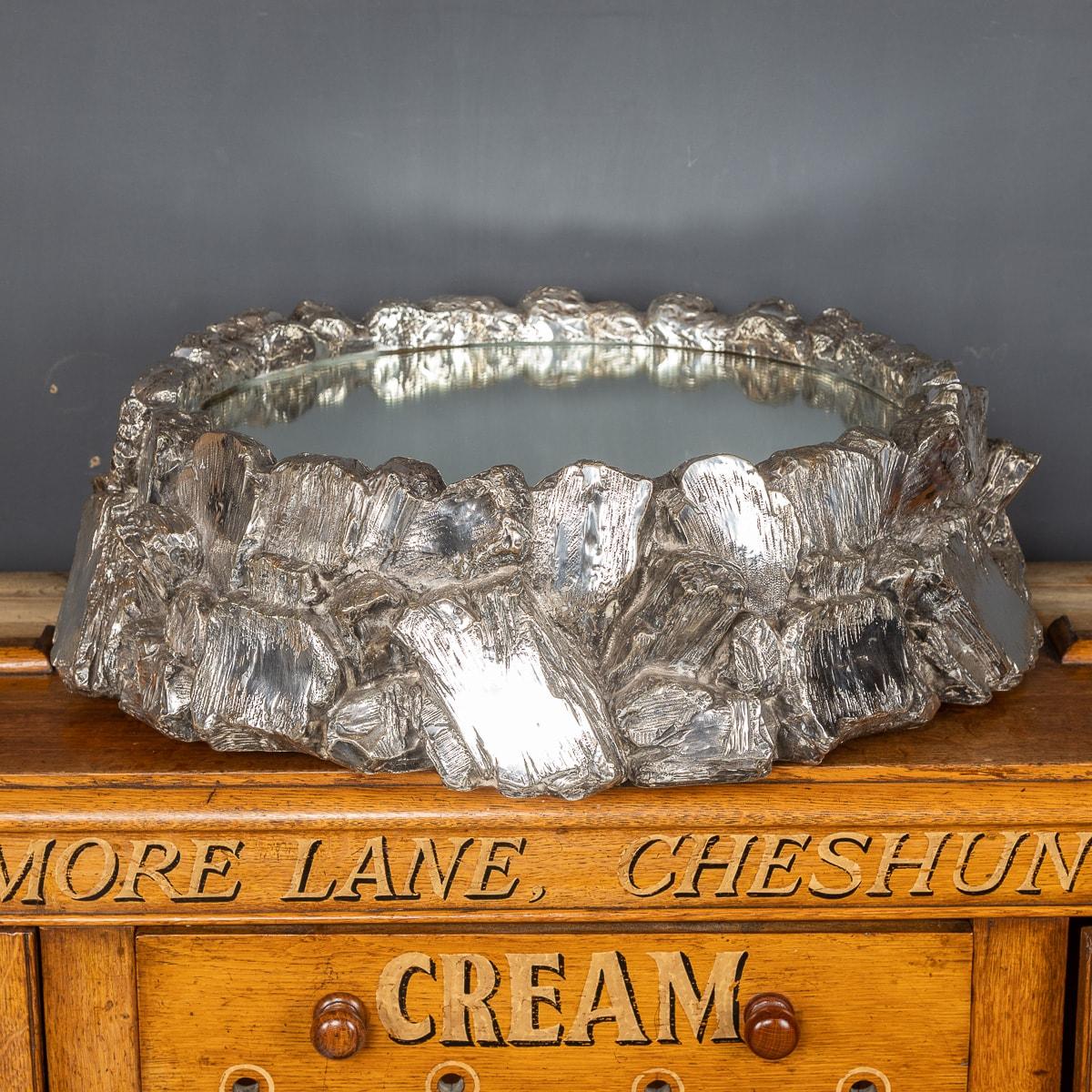 Antique late 19th century Victorian silver plated large wedding cake stand, of circular form, rock formation framing a mirrored plateaux and mahogany lined base.

Condition
In great condition - No damage.

Size
Height: 20cm
Diameter: 63cm.