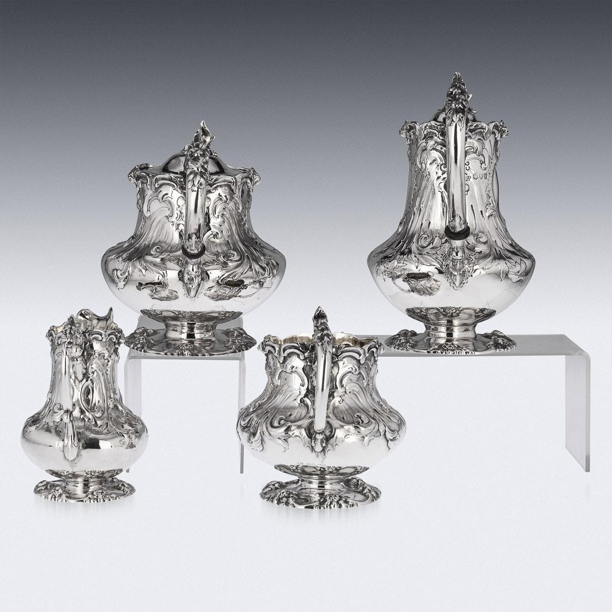 19th Century Victorian solid silver four piece tea & coffee service, comprising of a coffee pot, tea pot, sugar bowl and cream jug, each shaped body resting on a spreading cast floral stand, the body chased and embossed with roses and leaves,