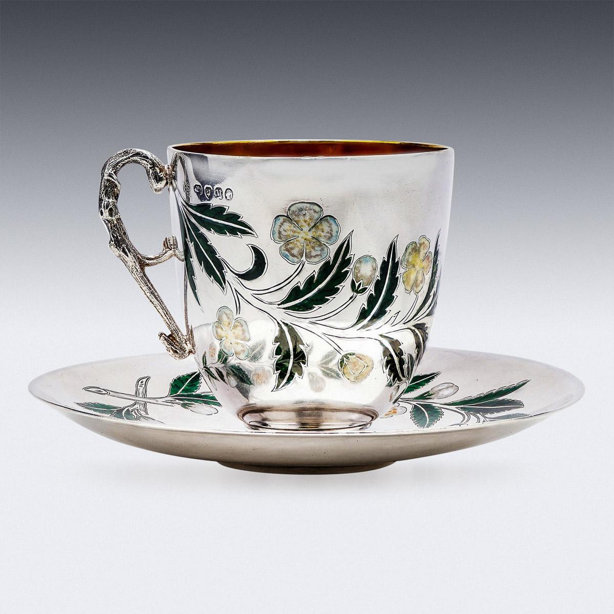 Antique 19th Century Victorian solid silver & champleve enamel tea cup and saucer, circular shaped and applied with shaped handle, plain rim and spreading domed foot, body decorated with flowers and foliage, exquisite quality and impeccable use of