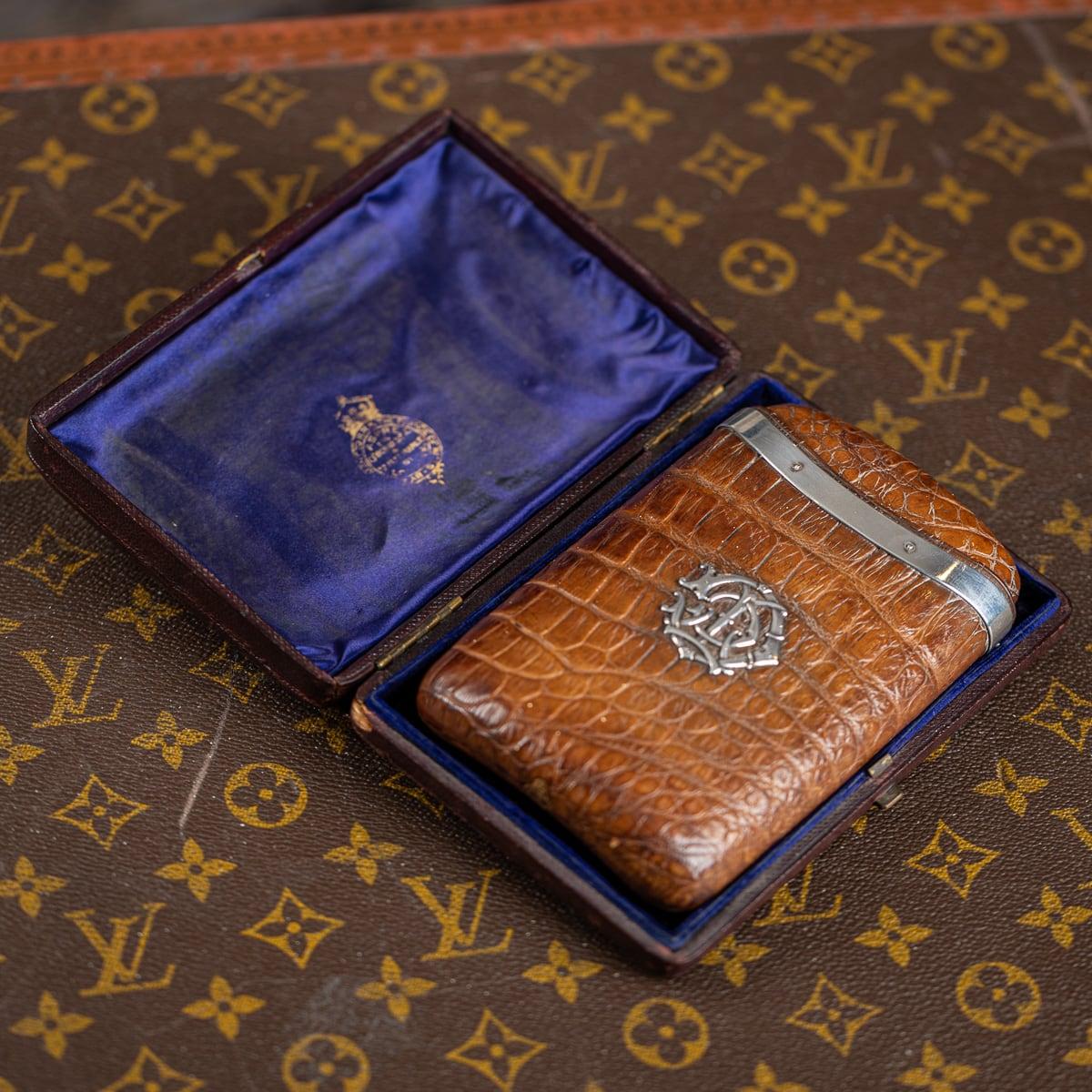 Antique 19th Century Victorian solid silver mounted on sumptuous crocodile leather cigar case. It is of rounded rectangular form, with a pull off lid and interior that is sufficient for four mid-size cigars. Mounted on the front is a decorative