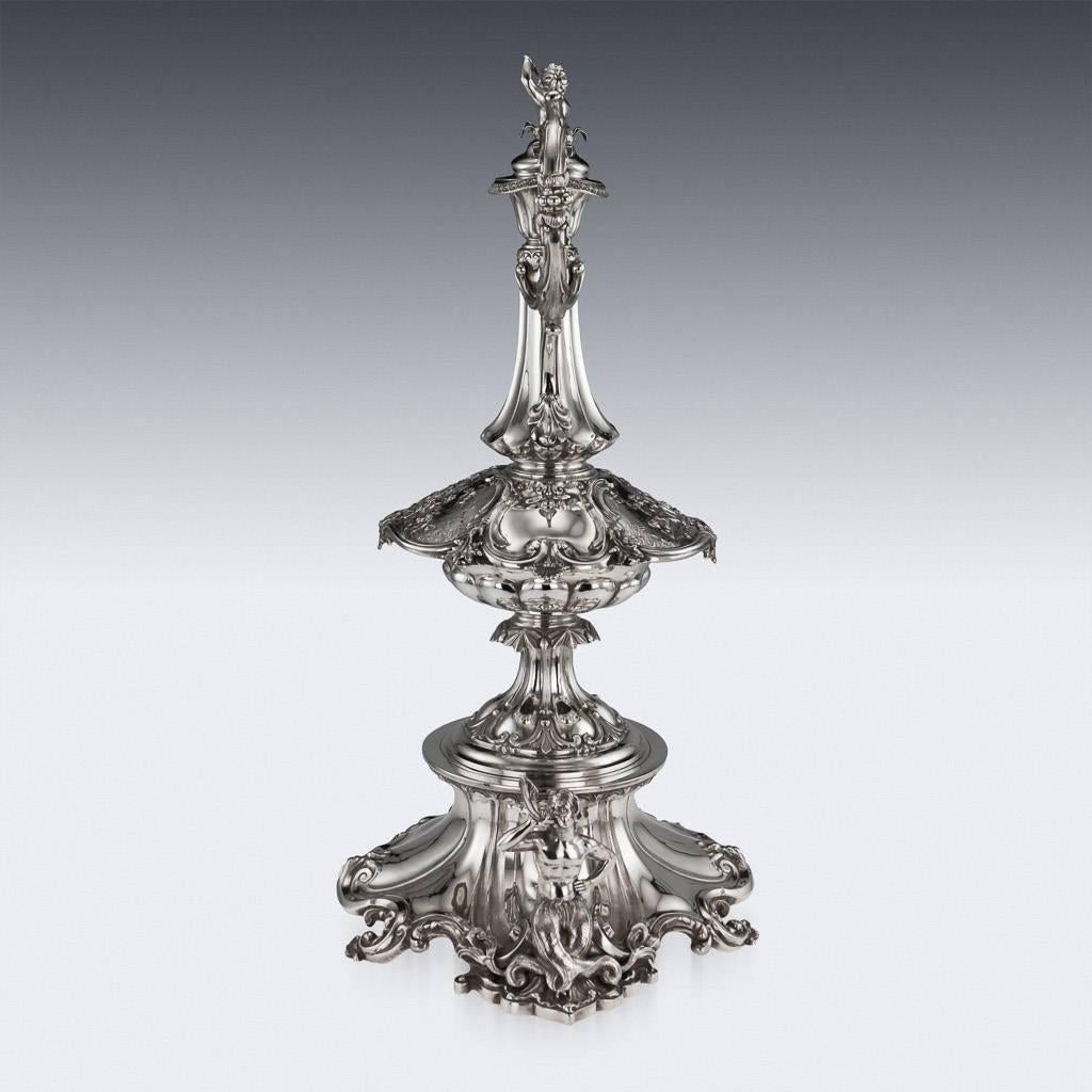 Antique 19th century exceptional Victorian solid silver figural wine ewer on Stand, extremely large and decorative, the body profusely chased and embossed on either side with a scenes of Galatea and attendants, an inverted fluted column neck, domed