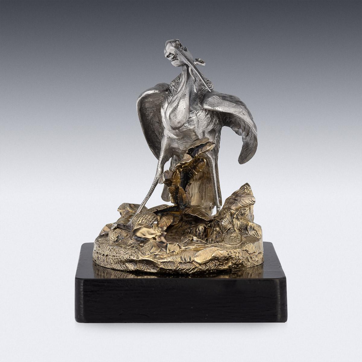 19th Century Victorian silver-gilt desk paperweight, on black ebonised base and mounted with a realistically modelled statue of a heron catching a snake amongst vegetation, extremely detailed and of the finest quality.
Hallmarked English Silver