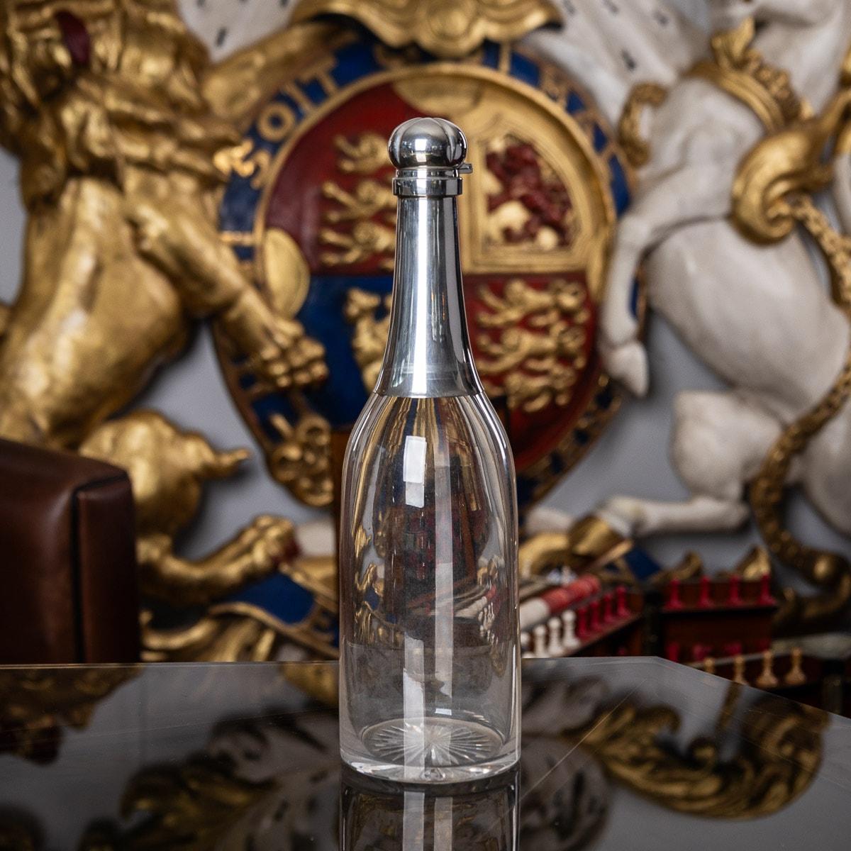 Antique late-19th Century Victorian novelty solid silver & glass champagne bottle shaped decanter, with hinged lids and glass stopper. Hallmarked English silver (925 standard), London year 1895 (U), Maker J.G&S (John Grinsell & Sons). It is easy to