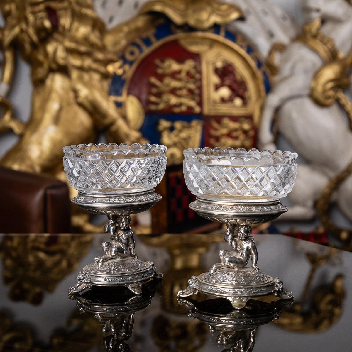 19th century Victorian pair of silver figural salts, each piece raised on an oval domed base on four scrolling feet, each stunning figural stems modelled like a faun holding a cornucopia, with an oval bowl mounted with cut glass.
Hallmarked English