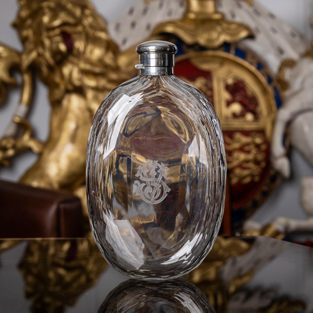 19th Century Victorian silver and cut glass spirit flask, unusually large, of rounded oval form, with a plain hinged and twist lid, the glass body hand engraved with large and very elaborate initials (SJV).

CONDITION
In Great Condition - No