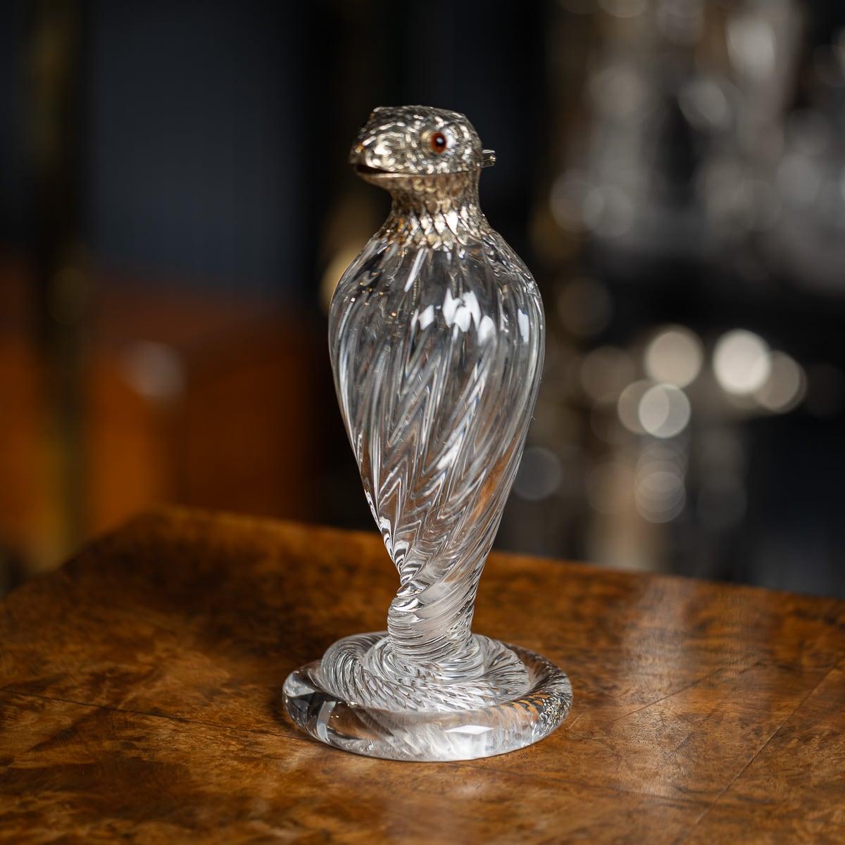 Antique 19th Century Victorian solid silver & glass cobra snake shaped claret jug. The clear spiral-fluted tail ascends to an inverted baluster body, silver mounted with a scaled silver neck and hinged head with glass eyes. The silver interior is
