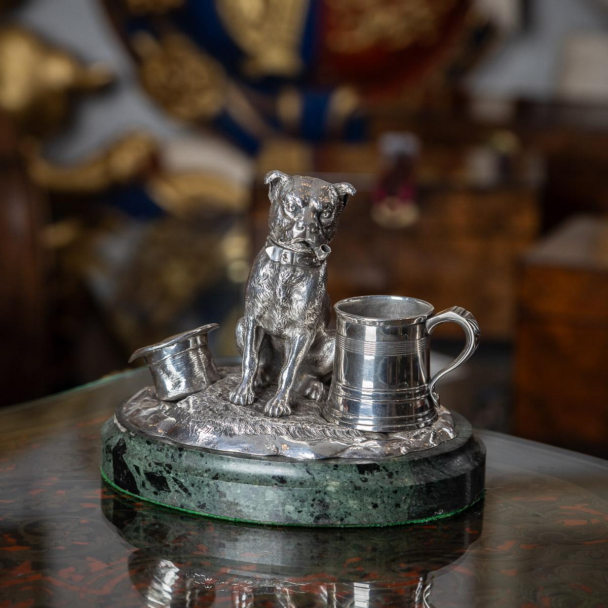 Antique 19th Century Victorian solid silver smoker's compendium, fashioned in the form of a seated dog indulging in a pipe, featuring a pull-off head. The charming design is complemented by a miniature tapering tankard and a top hat, all gracefully
