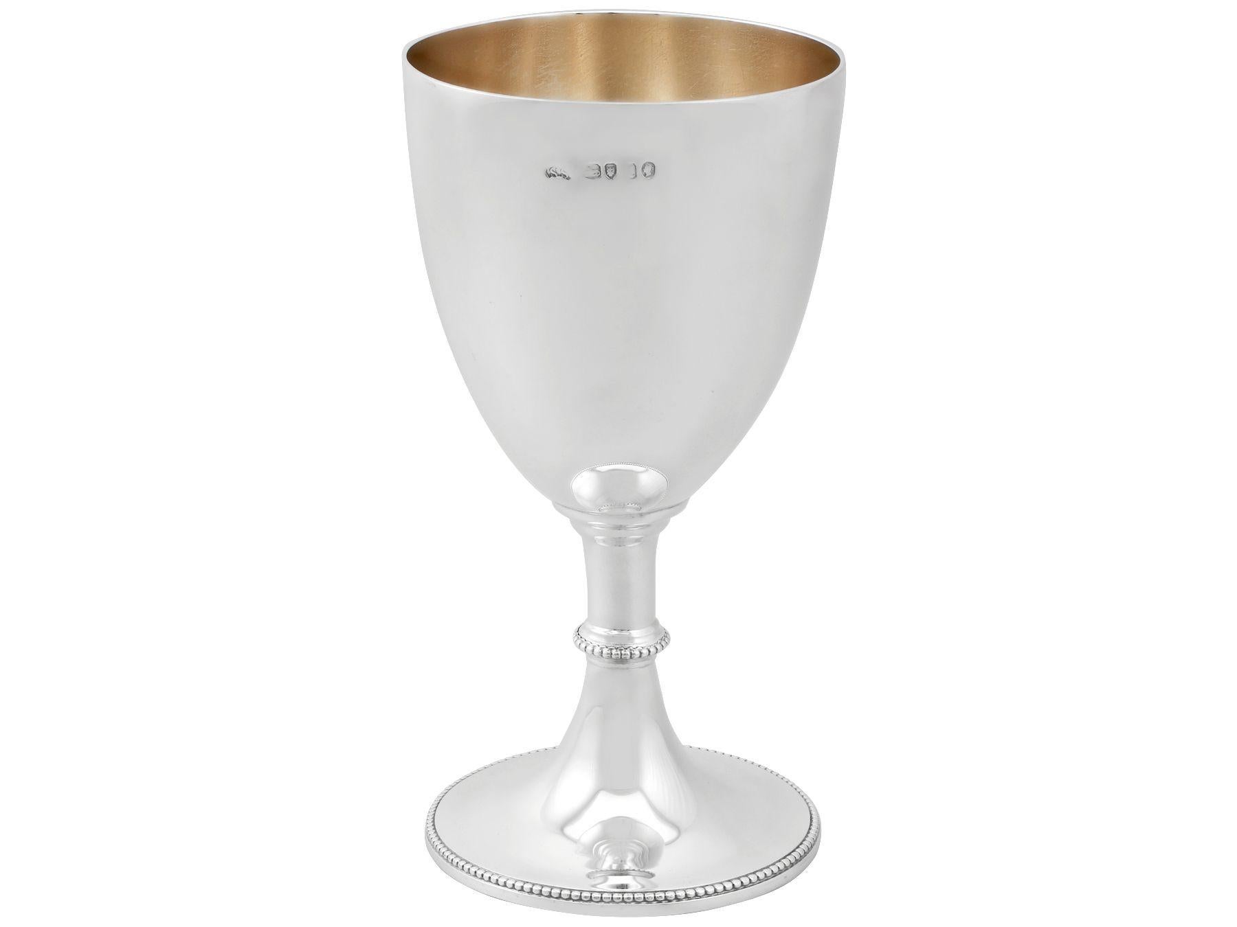 An exceptional, fine and impressive antique Victorian sterling silver goblet; an addition to our wine and drinks related silverware collection.

This exceptional antique Victorian sterling silver goblet has a circular bell shaped form onto a swept