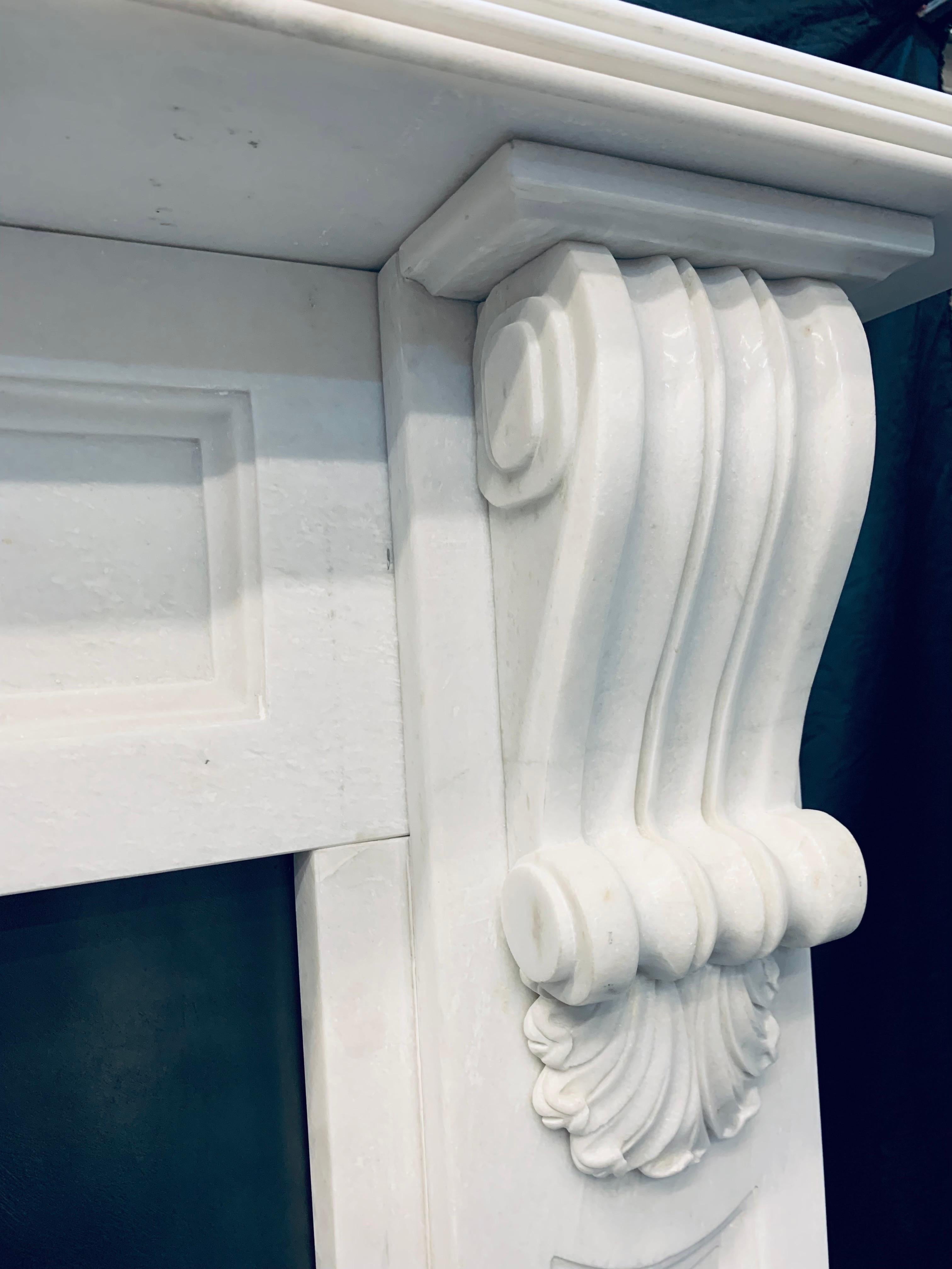 Carved 19th Century Victorian Style Statuary Marble Corbel Fireplace Surround.  For Sale