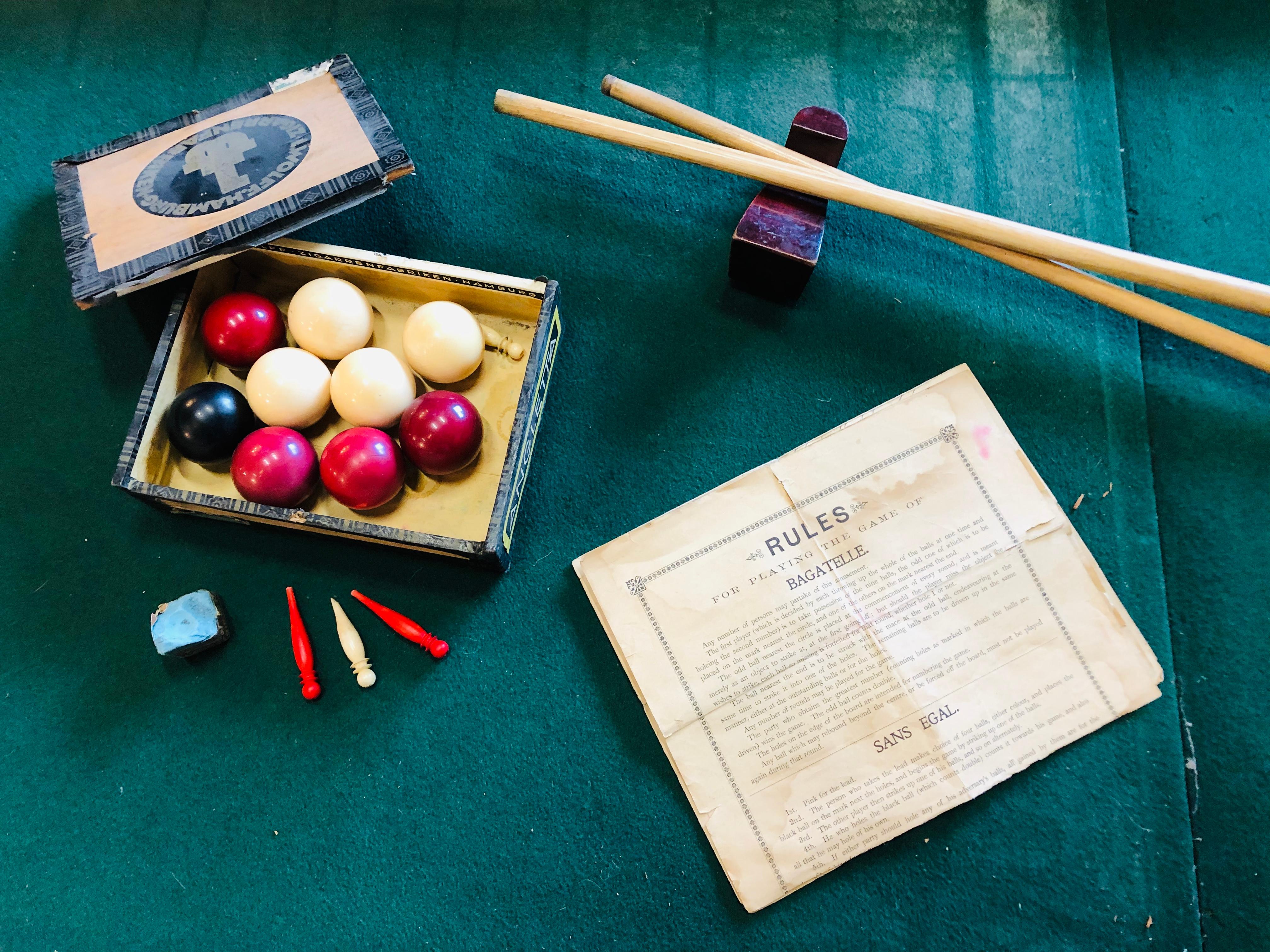 This rare antique table billiard is from England, circa 1900 and due to its age it is particularly rare and still fully functional. It comes with 2 cues, 9 balls (4 white, 4 red and 1 black) and original instructions. Unfortunately, there is a