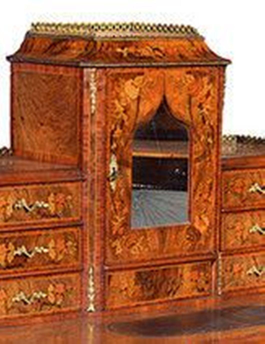 A  Victorian Franglais figured walnut Walnut Bureau de Dame with tulipwood and fruitwood marquetry inlay.
The central cupboard with a brass gallery to the top and a shaped inset mirror to the door and a central drawer flanked by three drawers, all