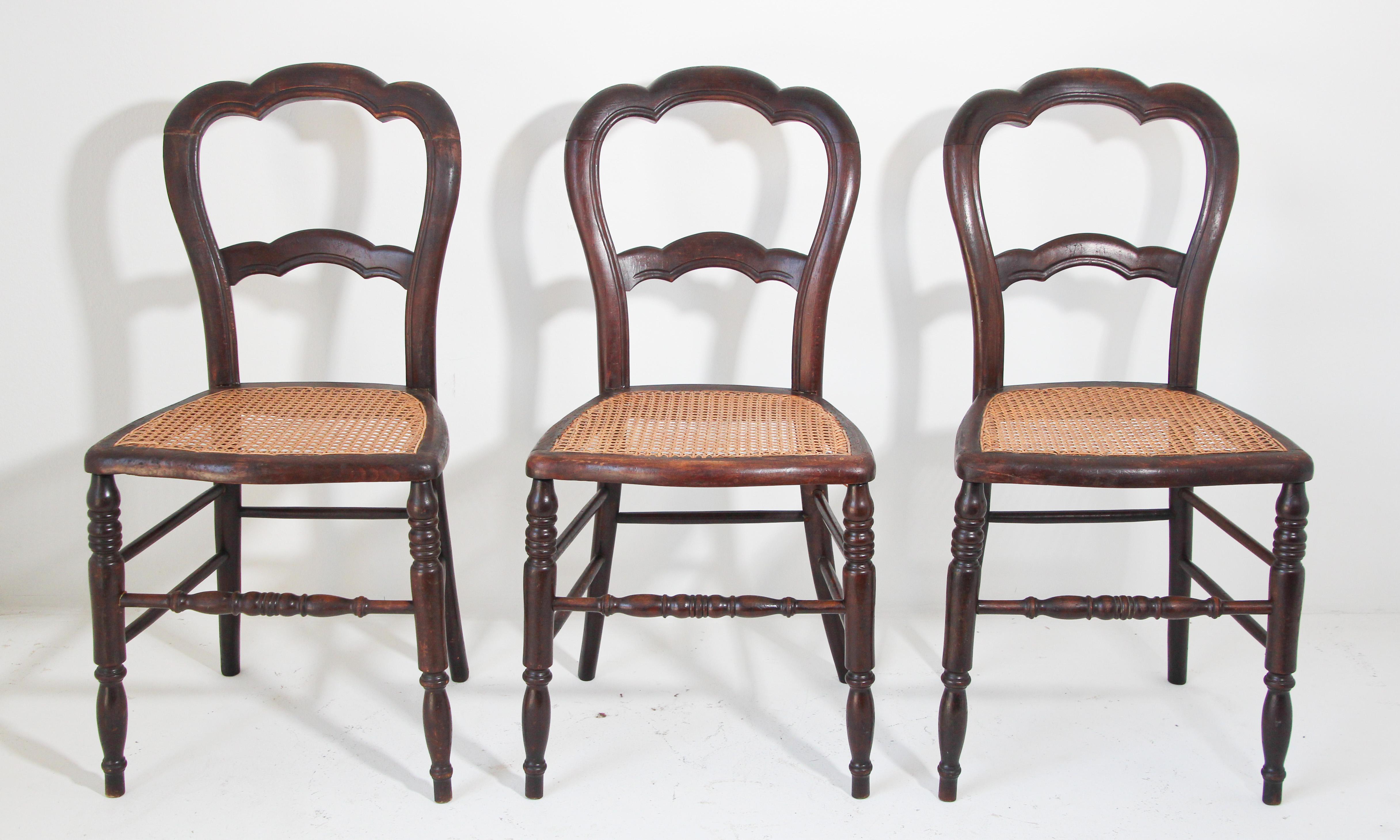 19th century French Provincial set of three Victorian style walnut occasional chairs with balloon backs
Antique French Country caned seat walnut chairs, each chair has a waisted balloon back with cabriole legs ending in scrolled French toes on