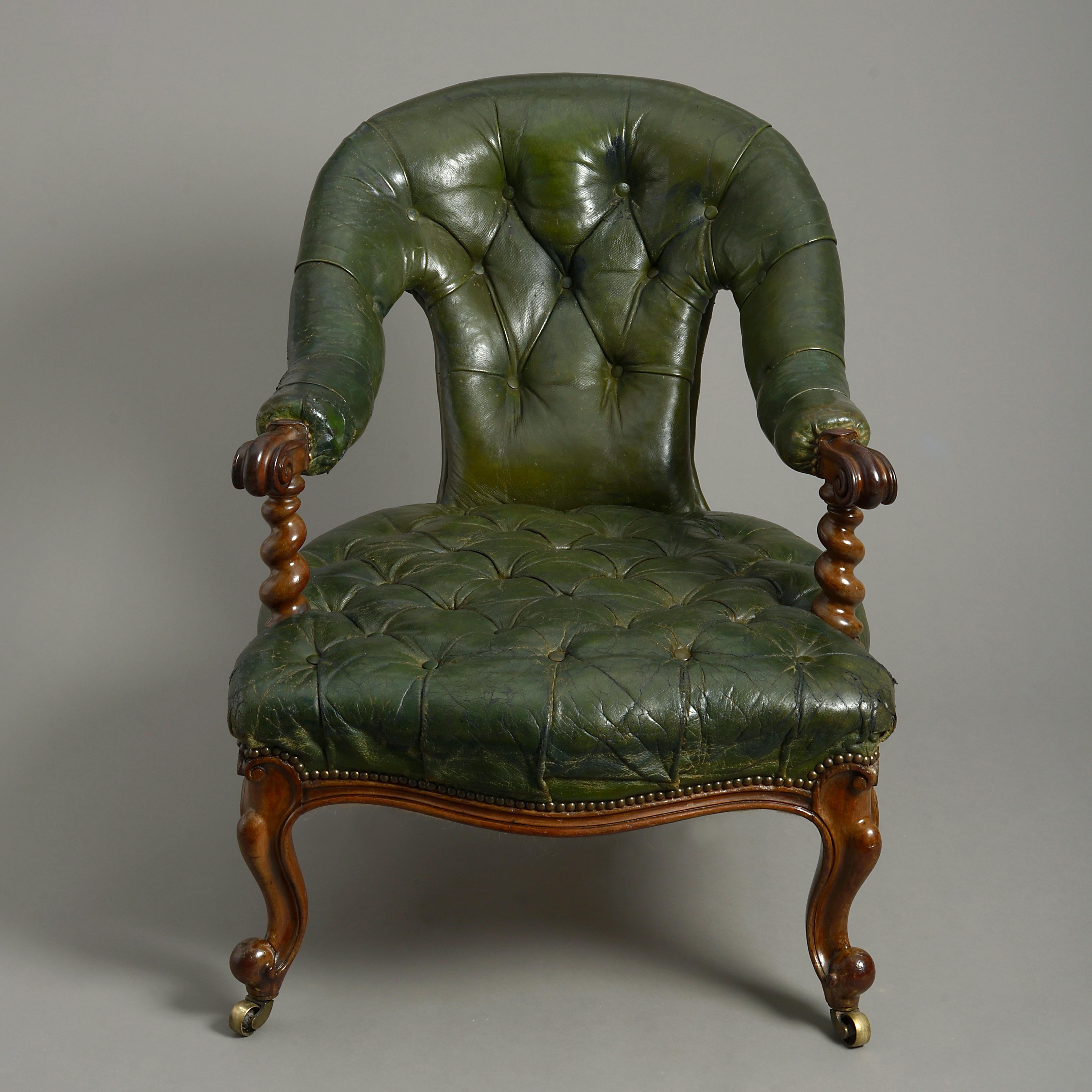 A mid-19th century Victorian Period club easy armchair, the back and seat retaining the original deep buttoned green leather covering, the arms supported upon barley twist walnut supports, the whole raised on cabriole legs of the same and