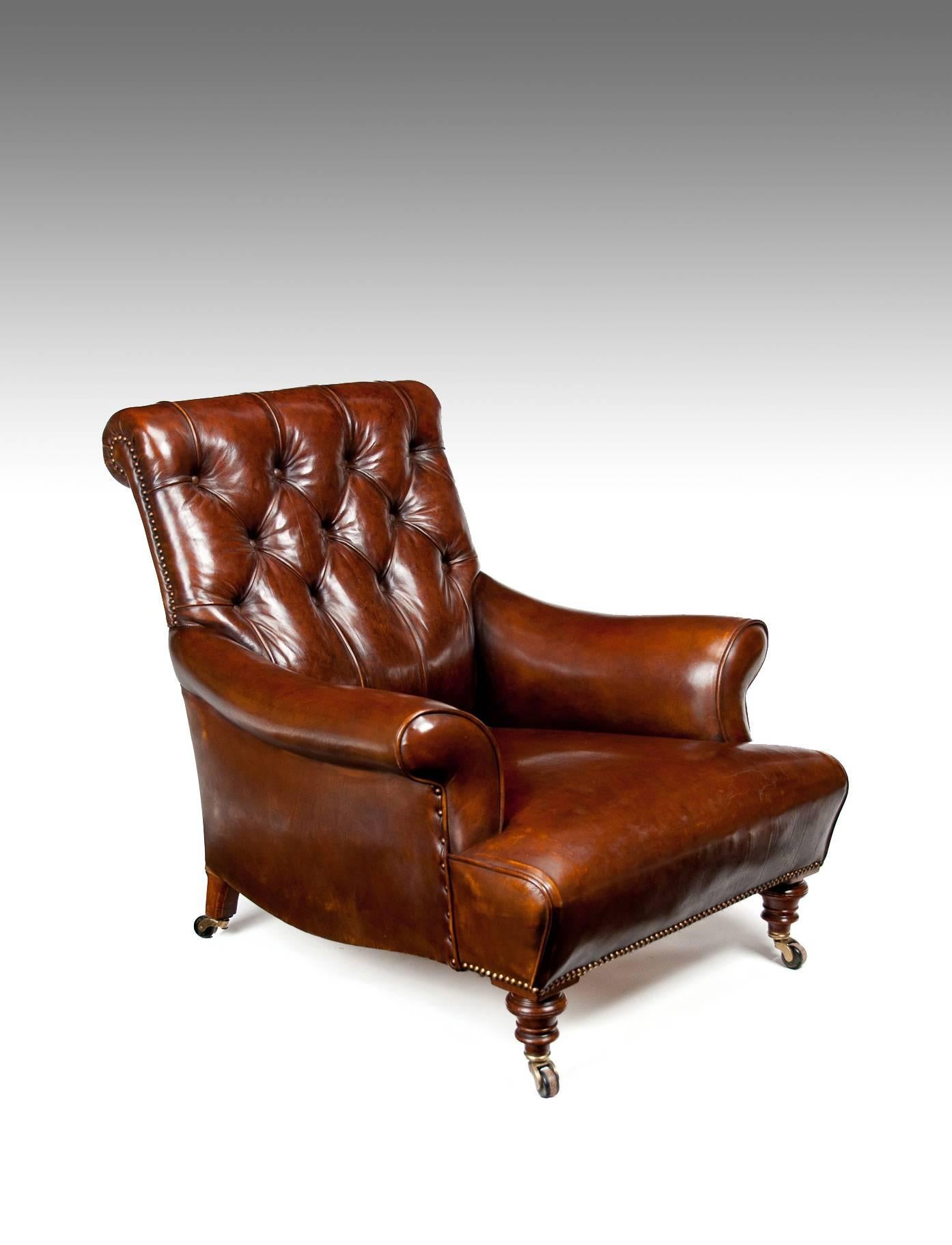 A fine quality 19th century Victorian leather upholstered armchair on walnut legs possibly by Jas Shoolbread, circa 1880.

Having a deep buttoned leather upholstered back and scrolled armrests with a sprung seat raised on turned solid walnut front