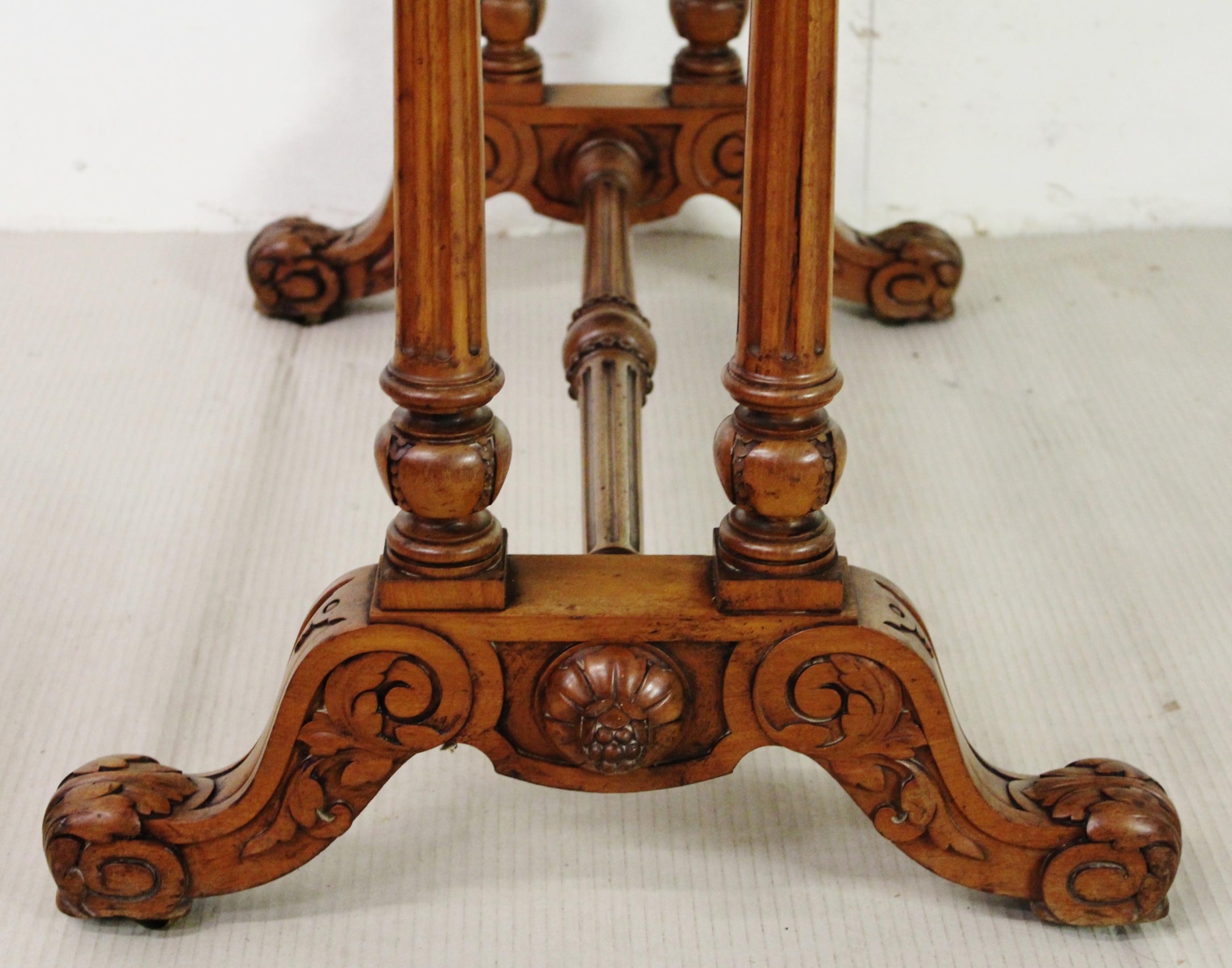 A superb quality mid-Victorian period walnut library stretcher table by C Hindley & Sons , Oxford Street, London. Of fine construction in solid walnut with attractive walnut veneers and cedar wood drawer linings. The shaped top fitted with a