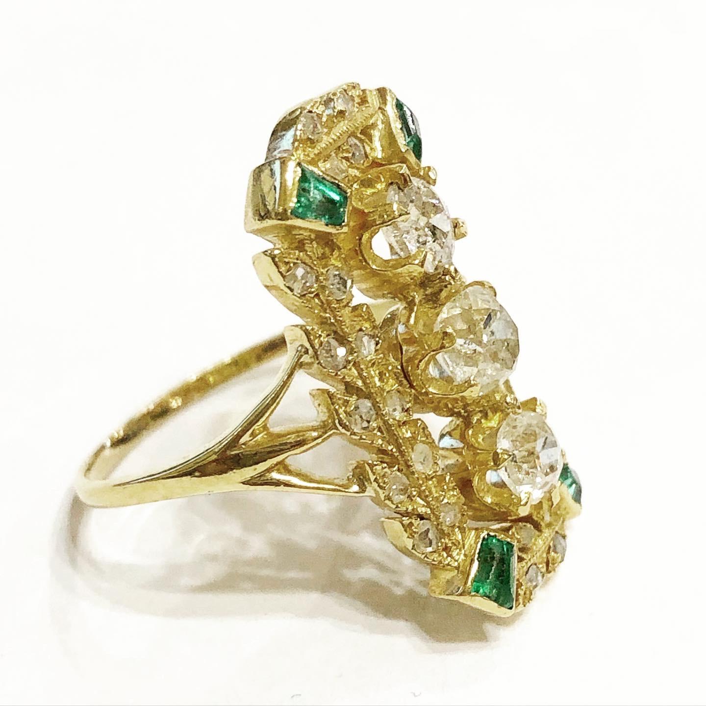 Victorian yellow gold, diamonds and emeralds cocktail ring.
Metal: 18 karat yellow gold.
Probably Spain. Condition:Good.
Old european and old mine cut diamonds. Trapezoidal emeralds.
Total approximate diamond carat weight:: 1 carats.
Height:  2.2 cm