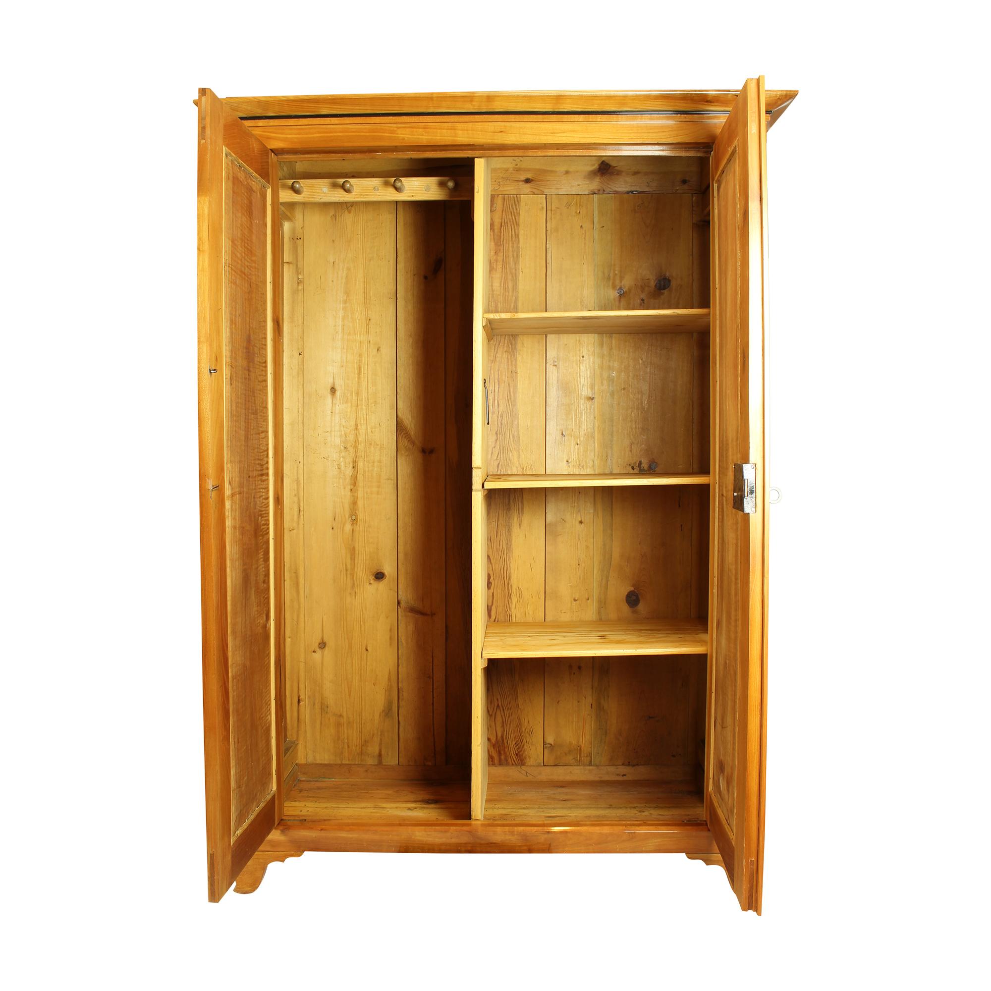 Beautiful wardrobe from the time of the Biedermeier circa 1840. Made of solid cherrywood. The wardrobe was lovingly restored by us. The wardrobe can be dismantled and shipped dismantled. An illustrated guide for the construction is enclosed. The