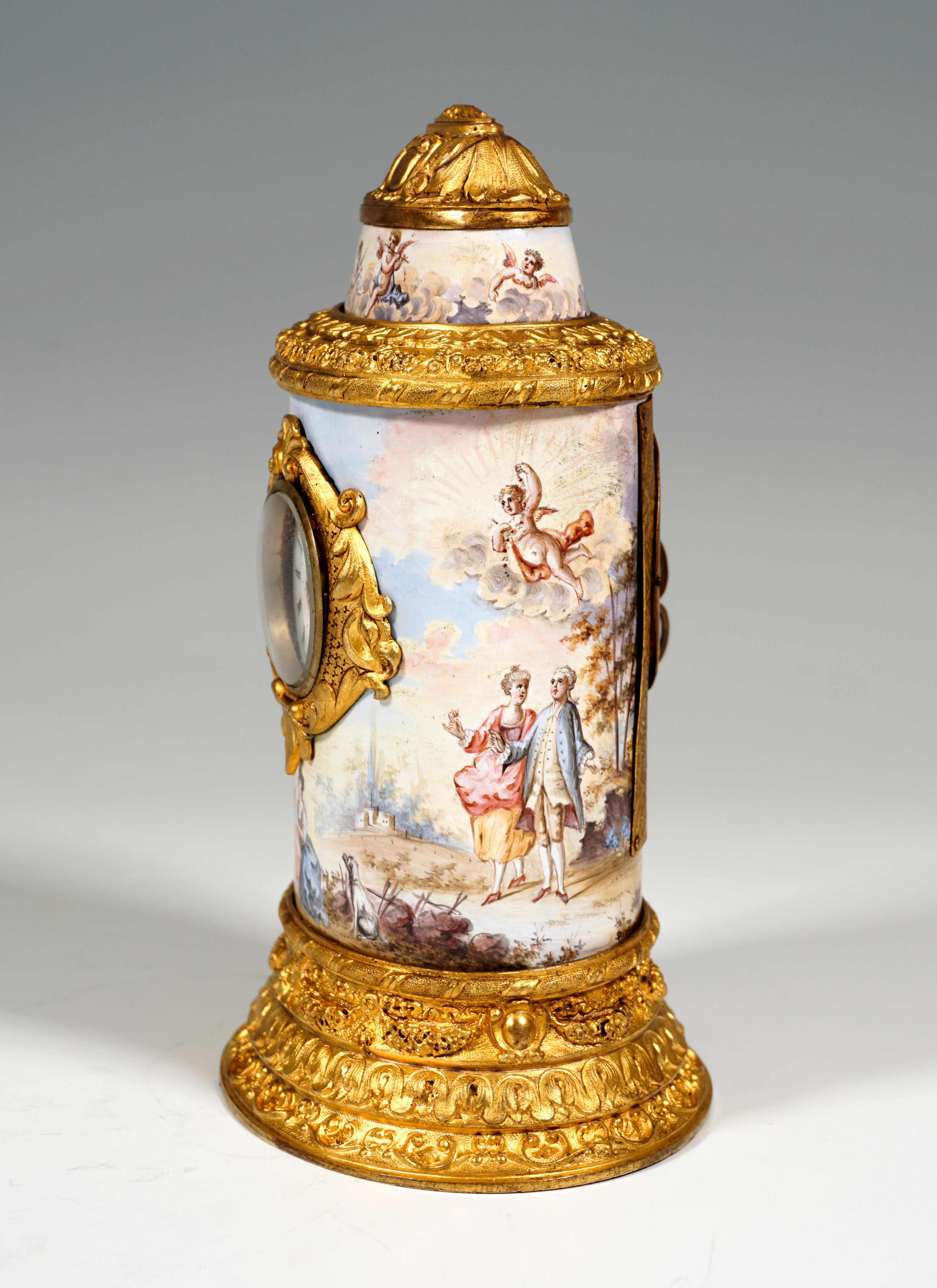 Finest Viennese Enamel work from around 1880:
Body in the form of an elliptical cylinder, designed like an advertising column: stepped base, faceplate and all covers made of fire-gilded bronze with tendril, leaf and rocaille bands, smooth surfaces