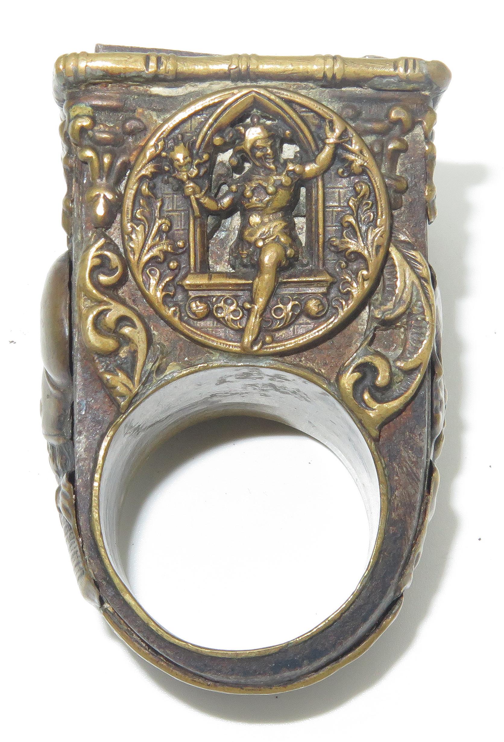 A beautifully designed, historic Bishop’s ring consisting of blended metals. Great craftsmanship throughout the ring, decorated on all four sides with high relief designs. The engraved lid hinges to reveal a secret compartment at the top, (often