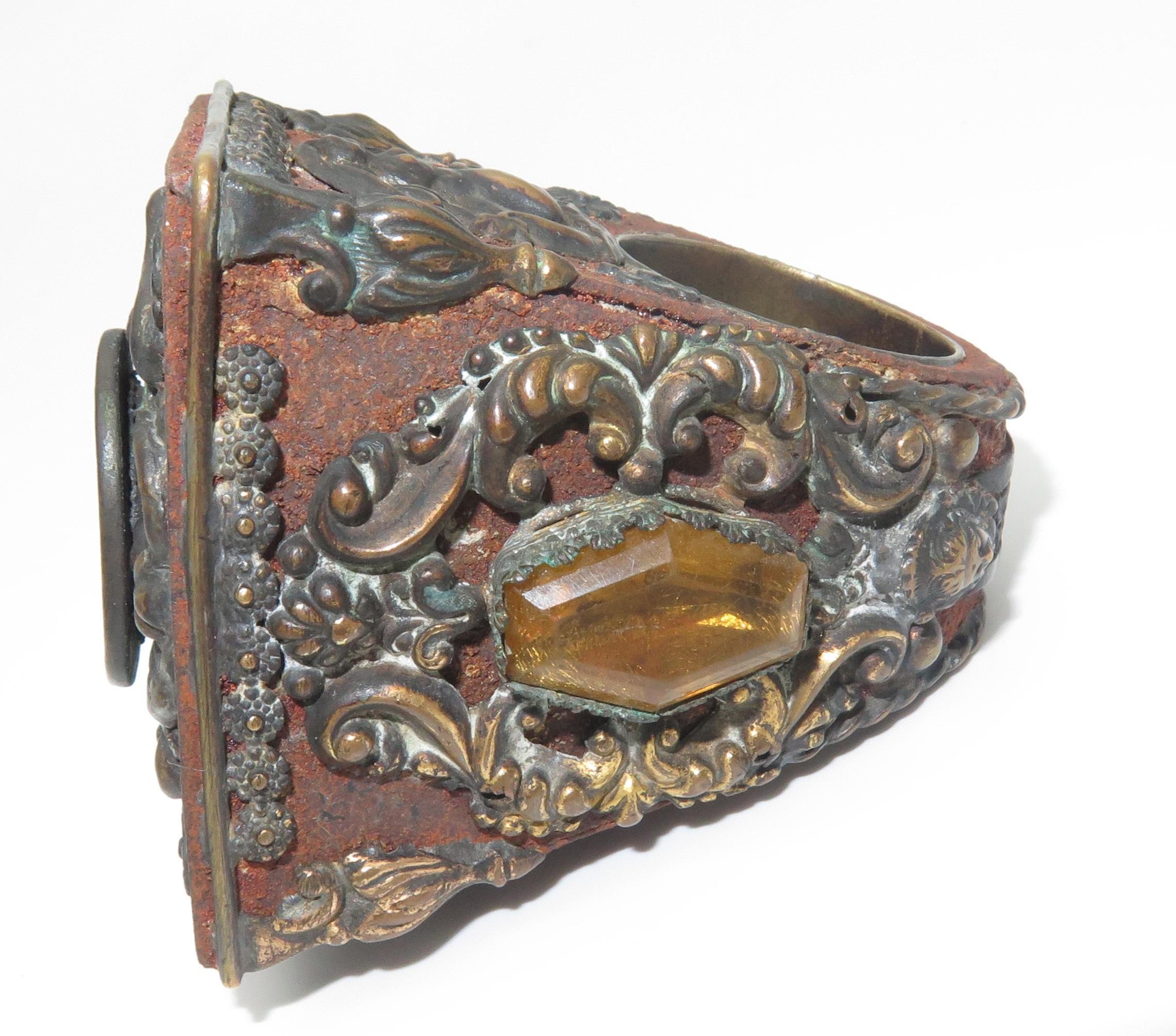A vintage historic Bishop Ring made of blended metals. Rings of this kind, that have survived over time, are rare finds. All four sides of the ring are decorated with relief designs of a contrasting metal. The weight of the ring is 177.8 grams. The