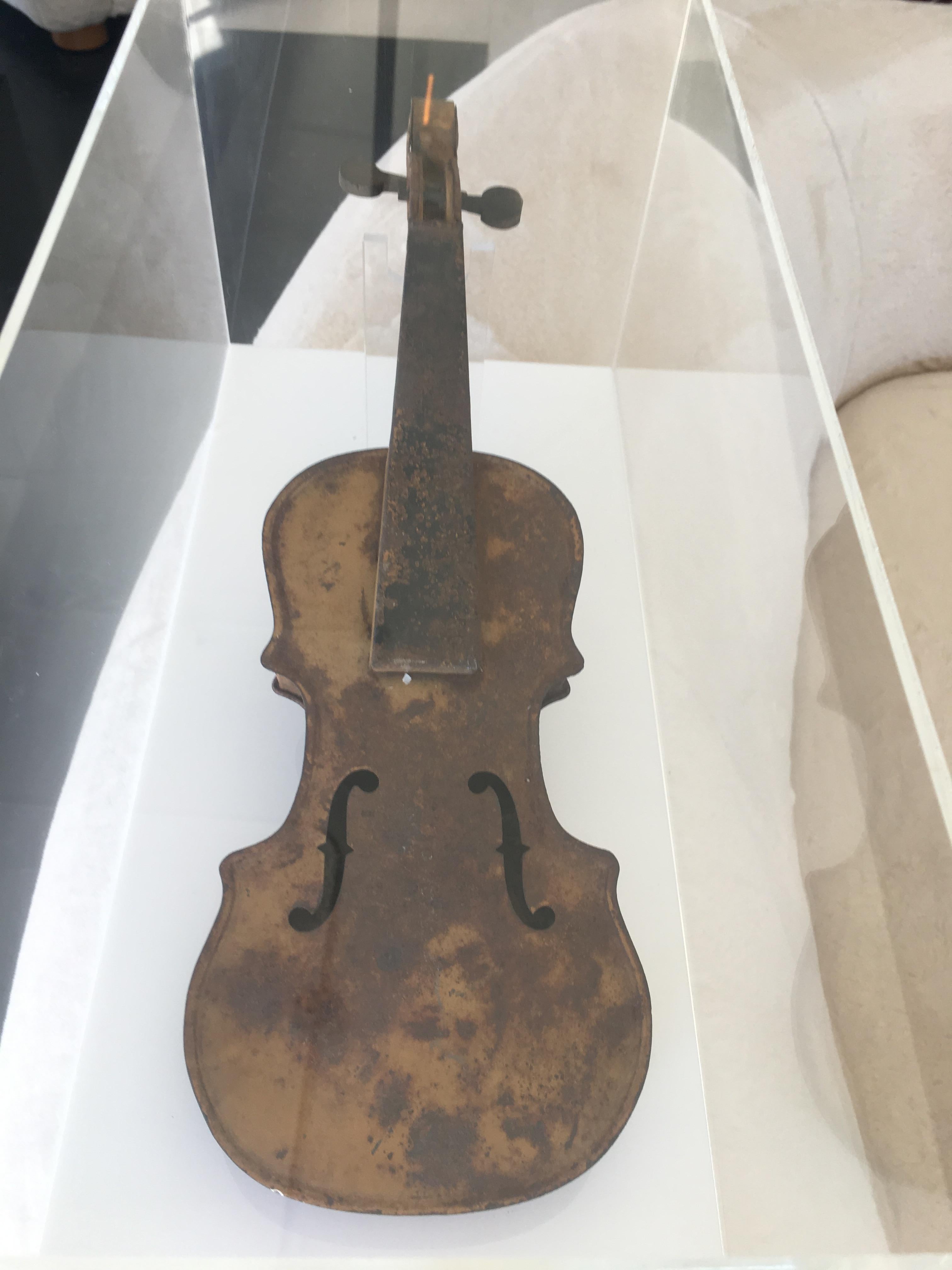 19th century rusted metal violin in plexiglass display box. Violin measures: 6