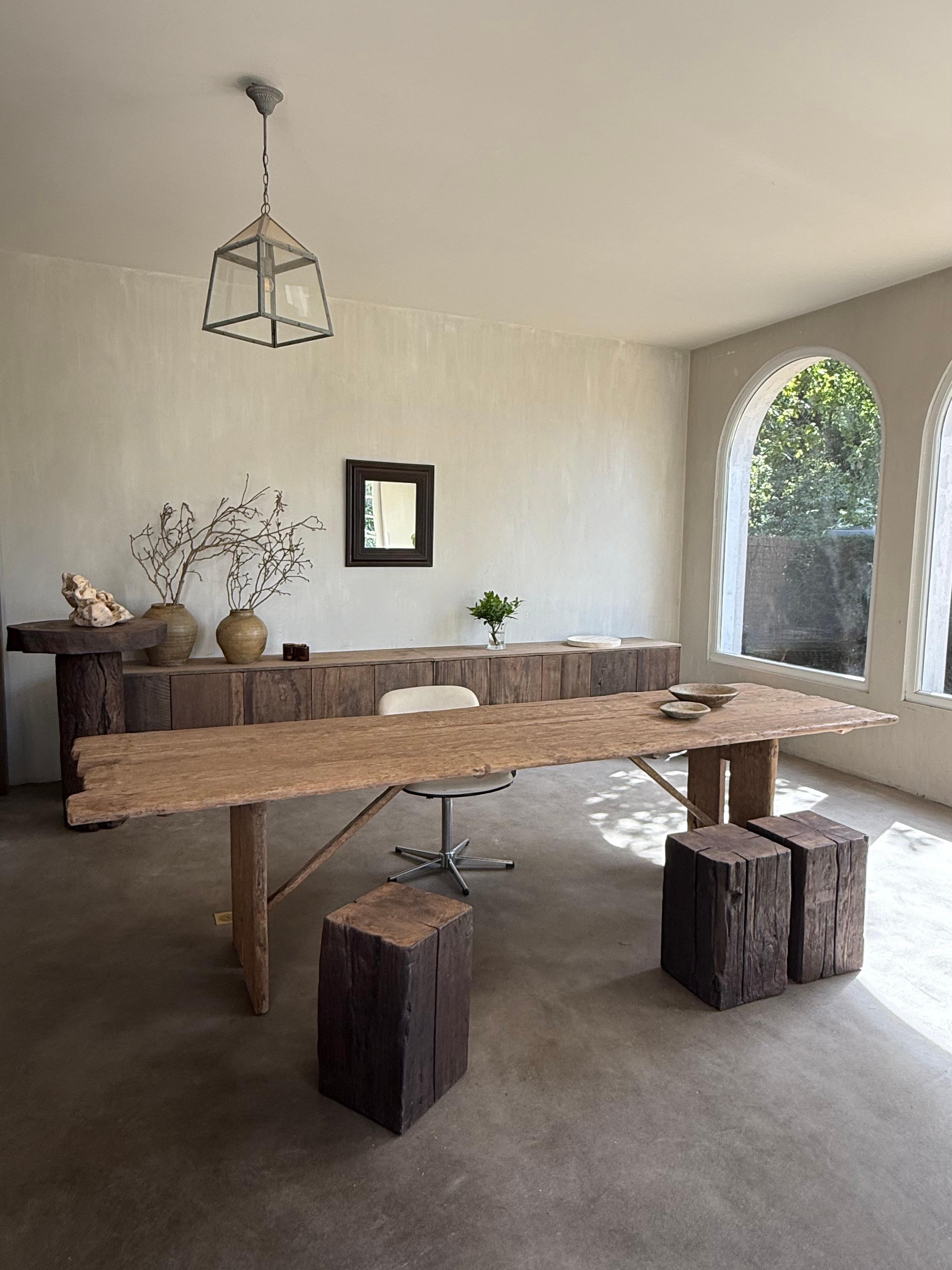 This beautiful, silky-smooth oak table was found in a Slovenian artist's studio.

It was used as a cutting table and general work table.
Its beautiful, irregular shape gives it an incredible wabi-sabi feel.

We've categorized it as a dining table,