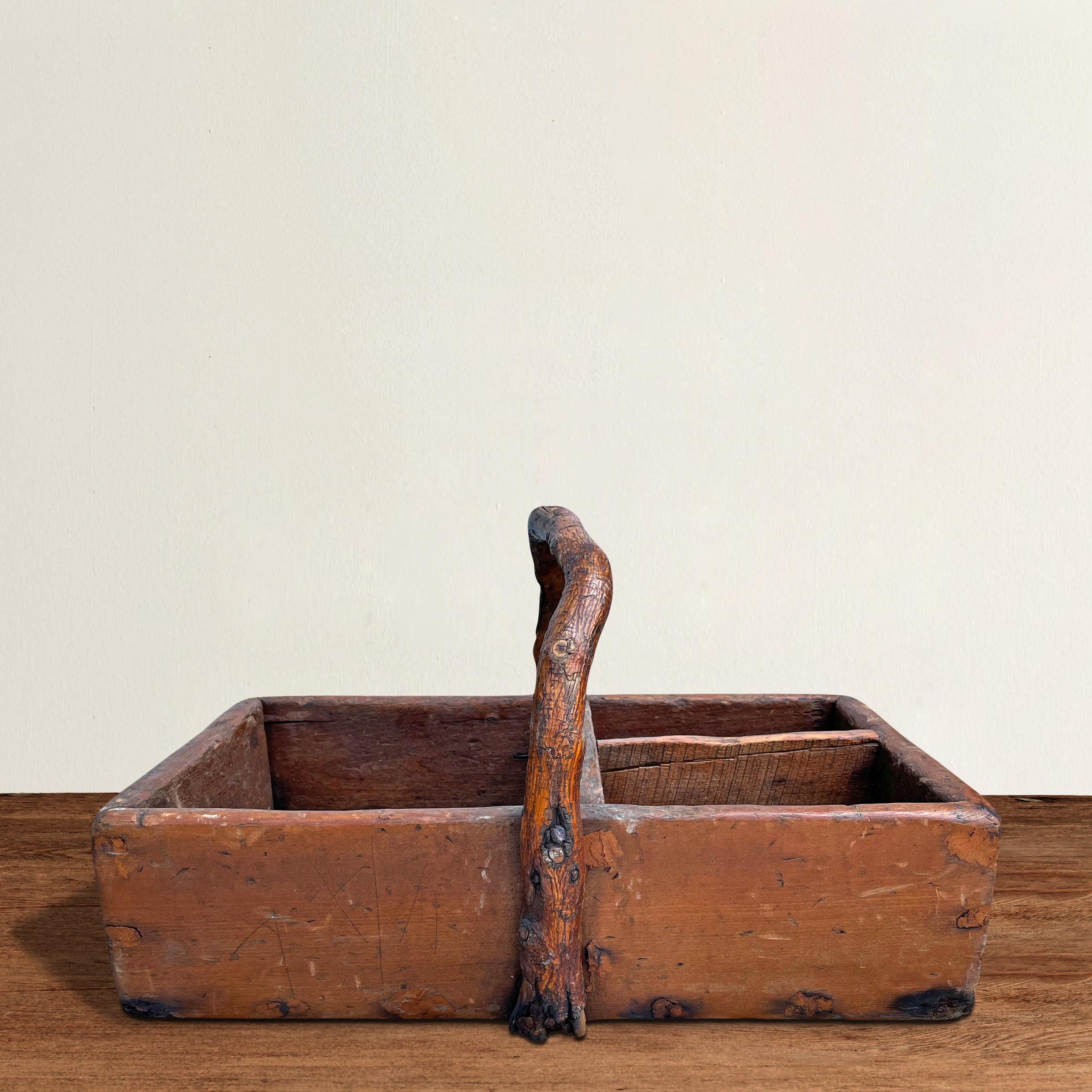 A wonderfully charming 19th century American caddy or tool box with the best whimsical wabi-sabi inspired natural bentwood hickory handle. Perfect for holding napkins, flatware, or other tableware accessories at your next garden party, or filled
